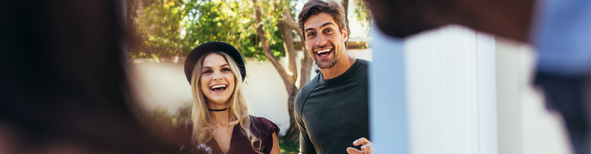 A man and woman smiling.