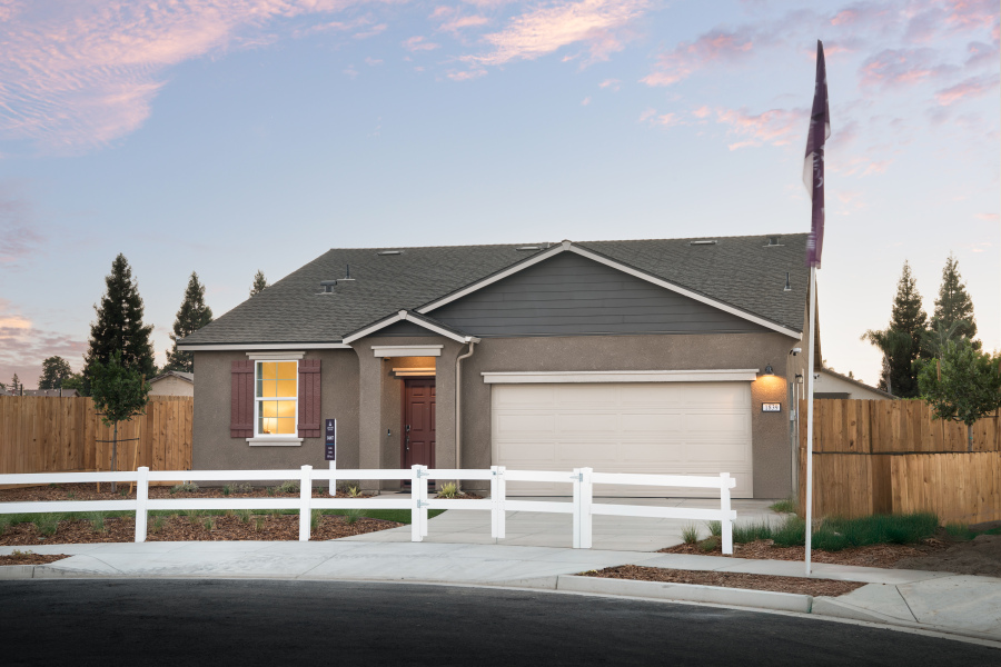 A house with a white picket fence.