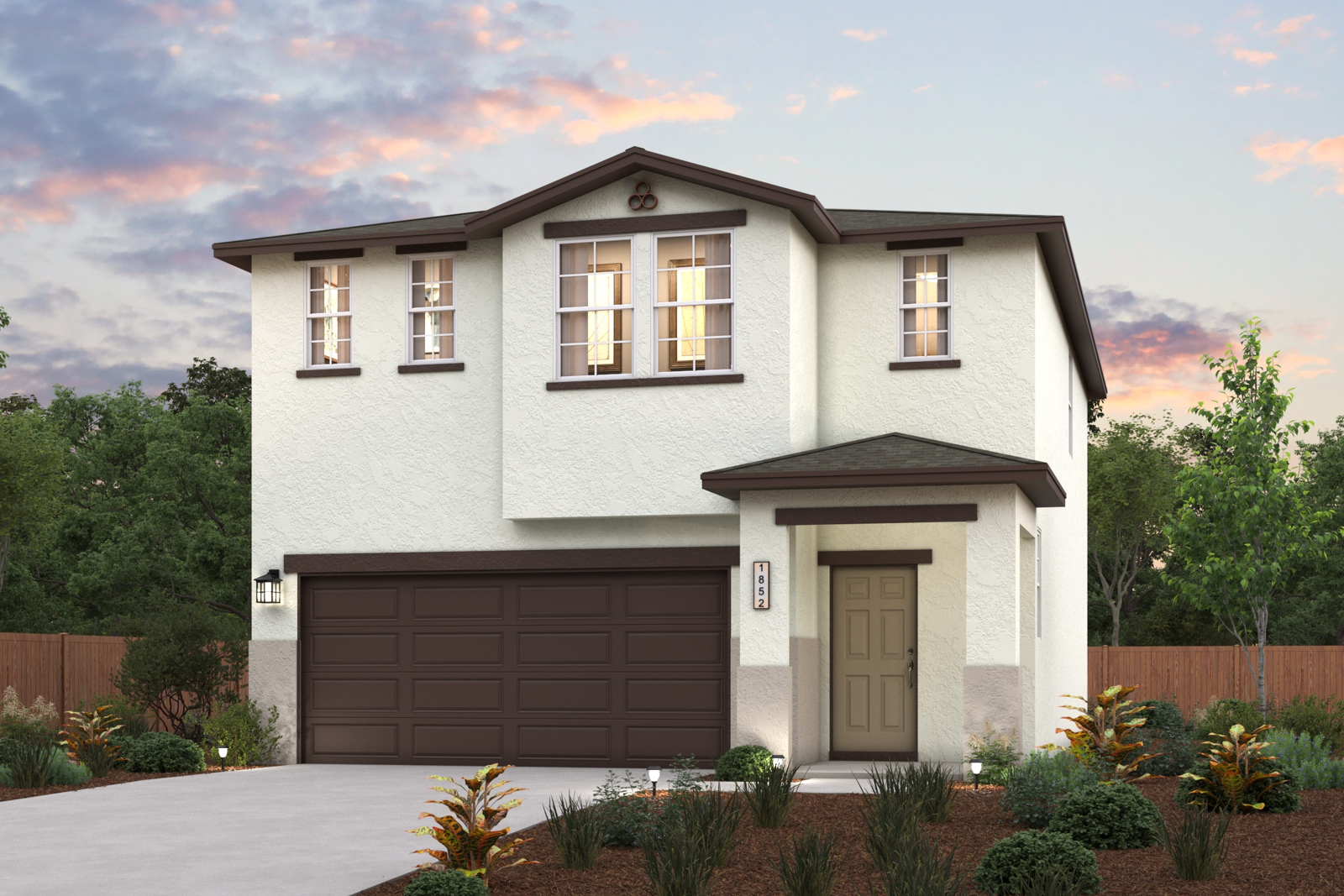 A house with a garage and trees.
