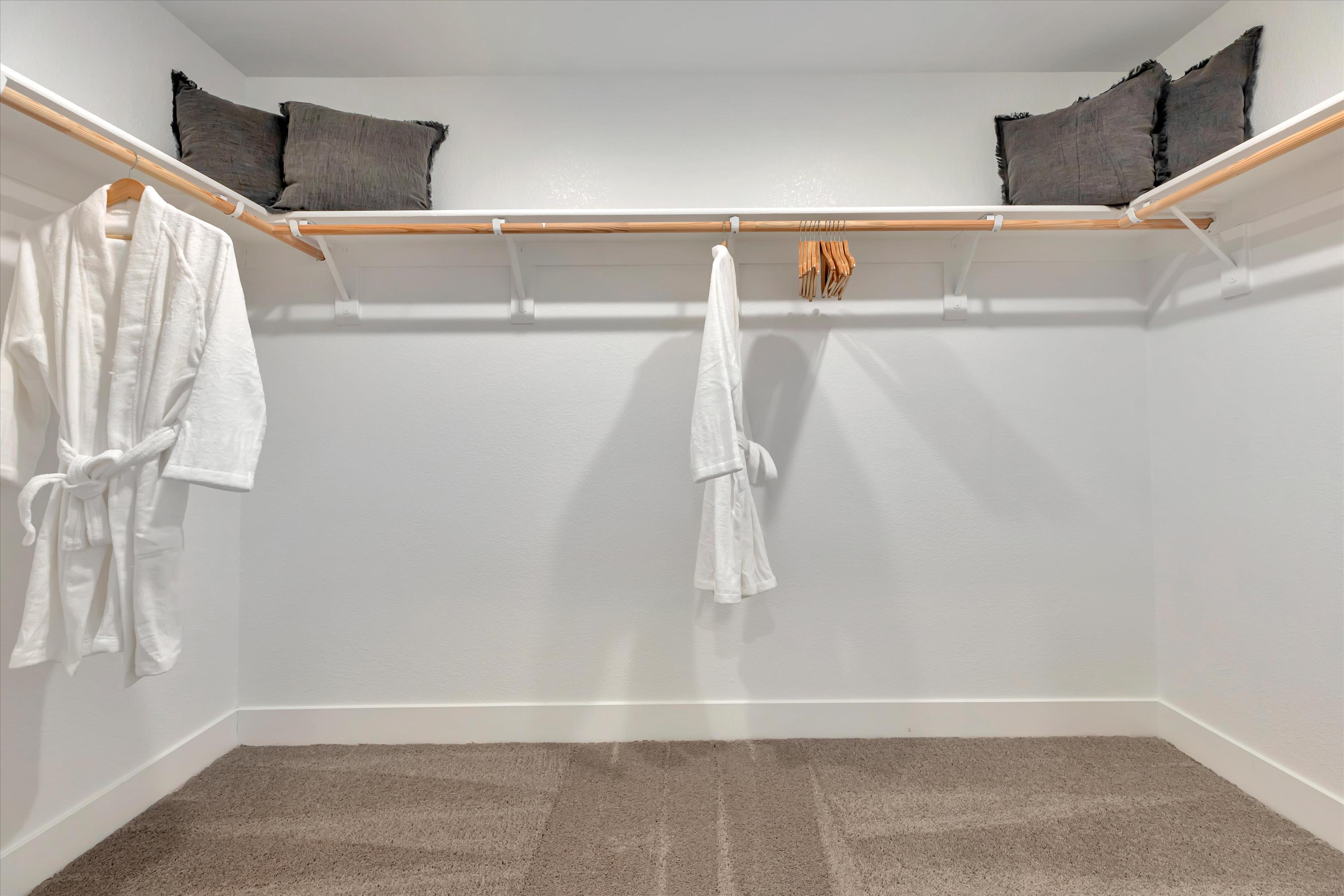 A row of white towels on a rack.