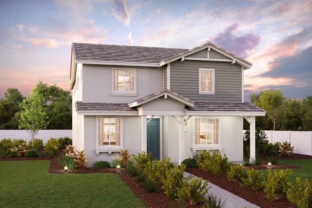 A house with a yard and a fence.