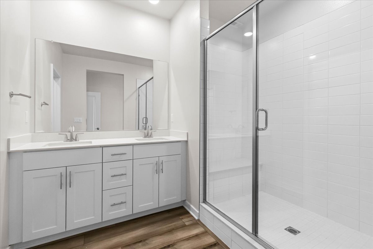 A bathroom with a glass shower.
