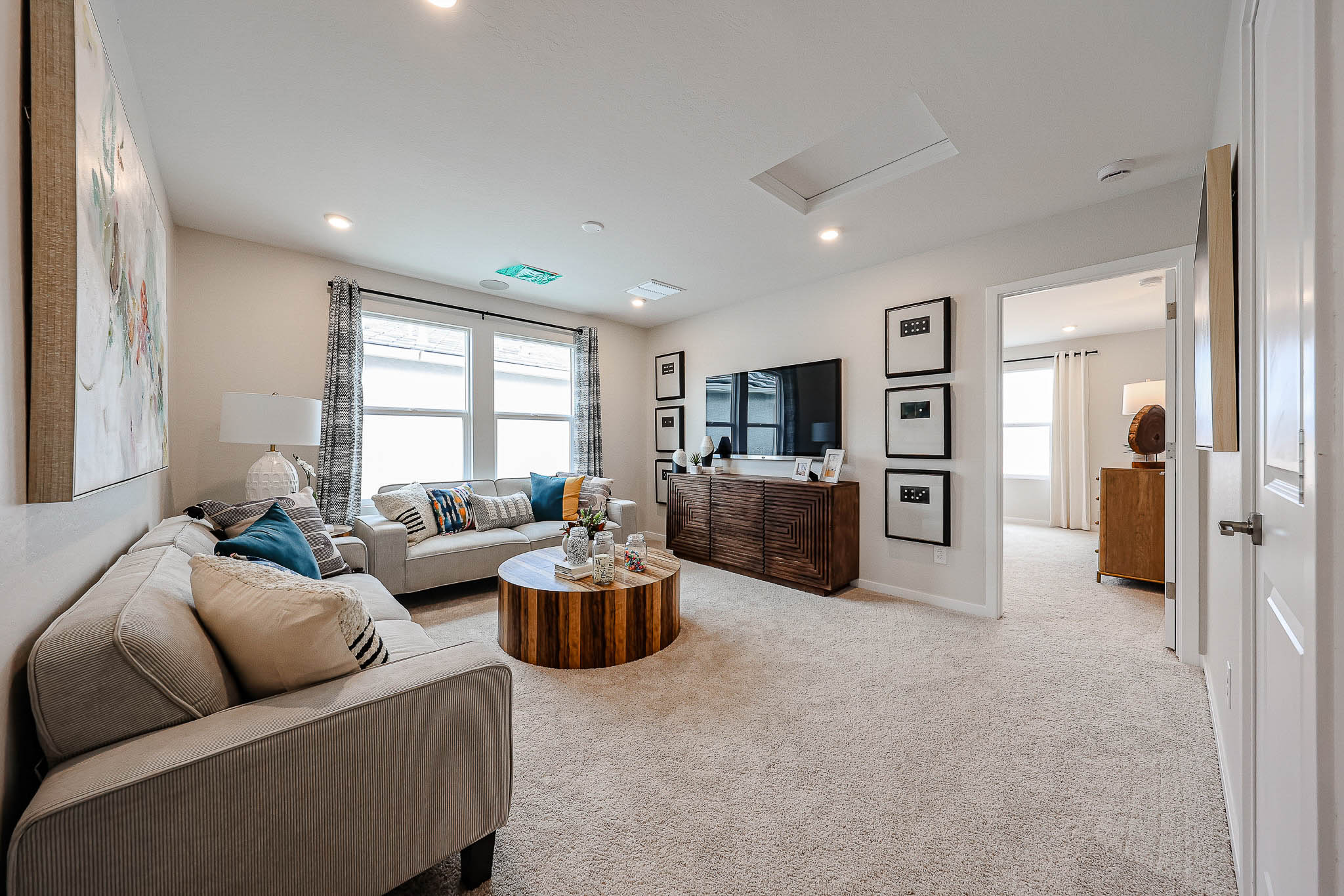 A living room with a large window.