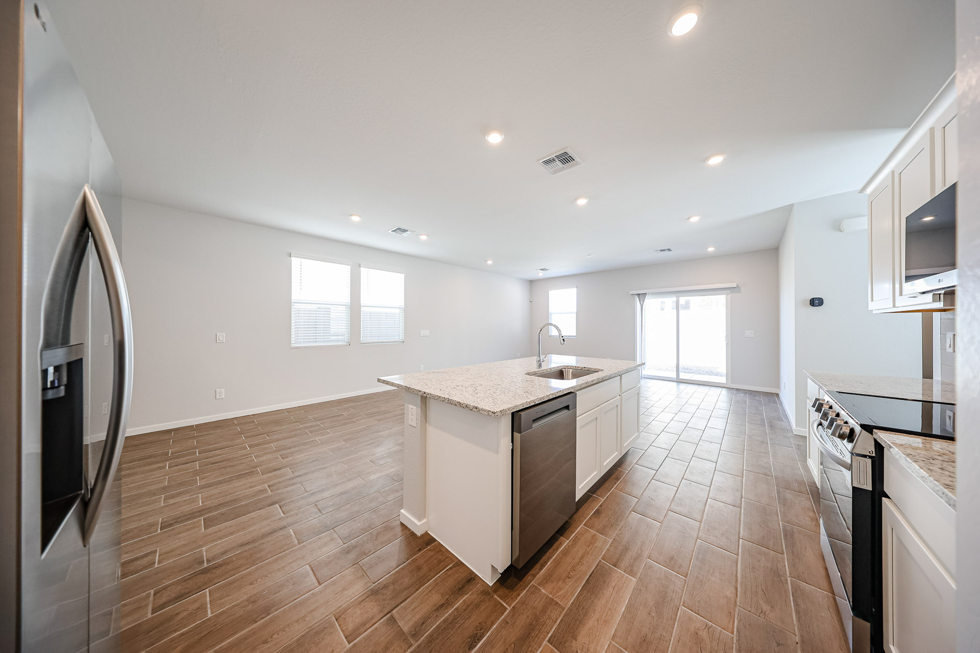 A kitchen with wooden floors.