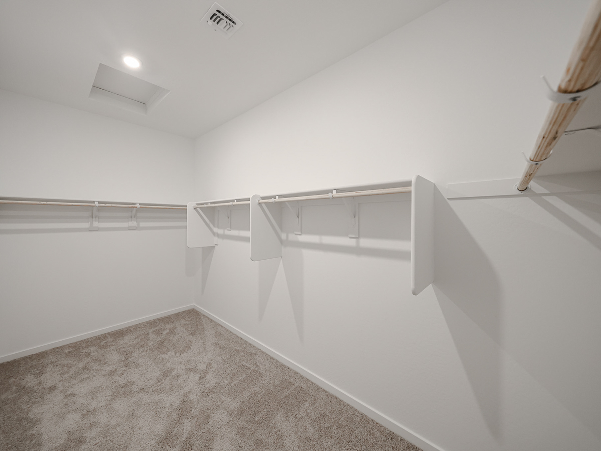 A white staircase in a room.