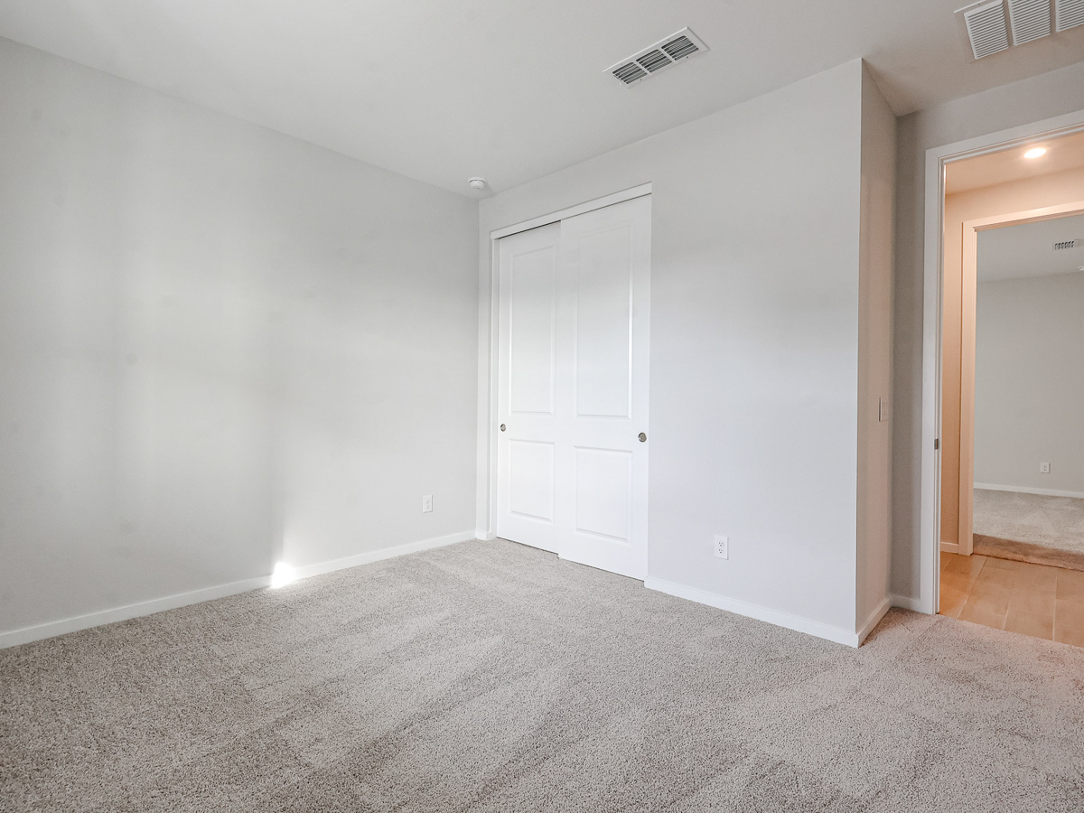 A room with a white door and a white door.