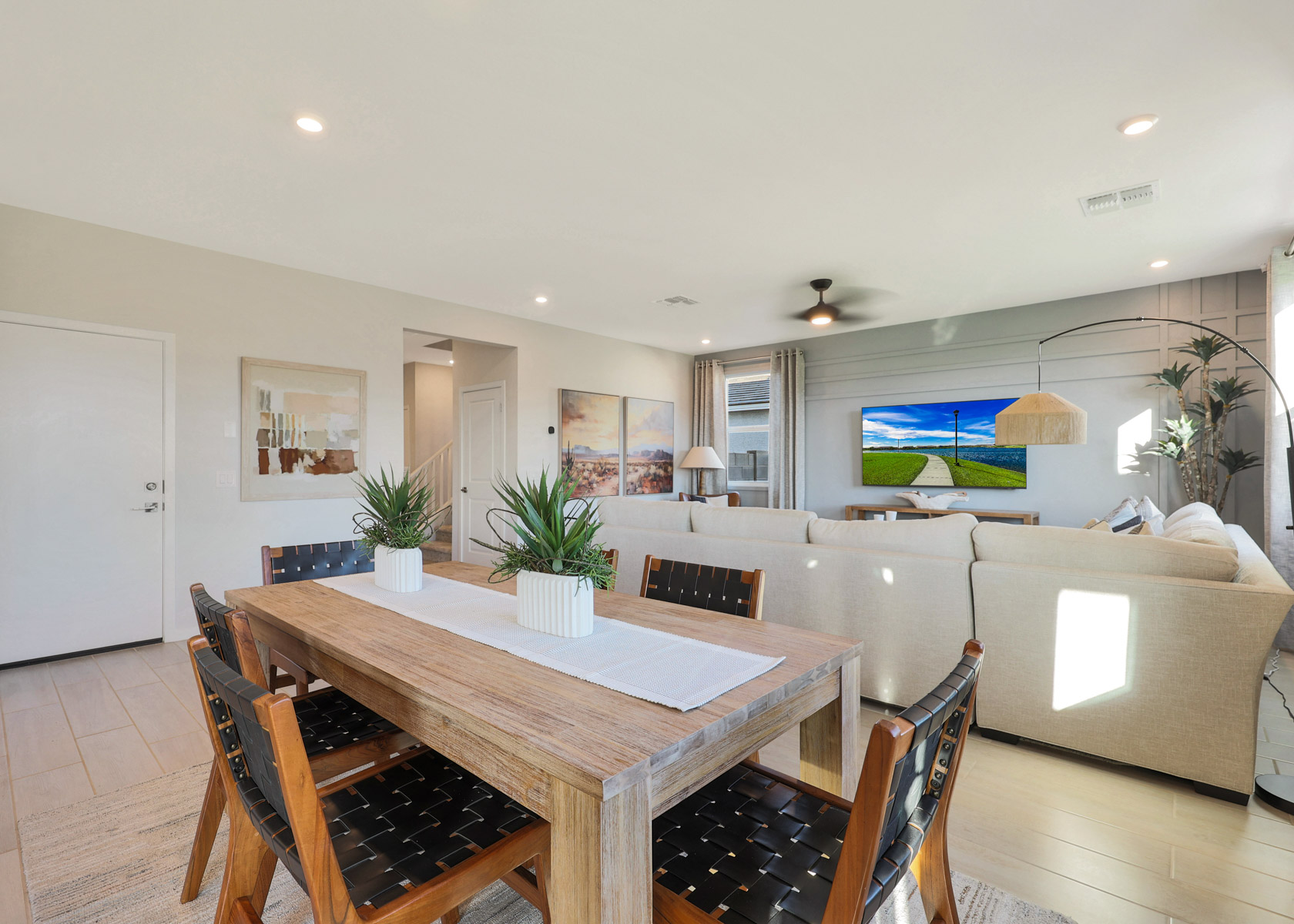 A dining room table with a couch and a couch.