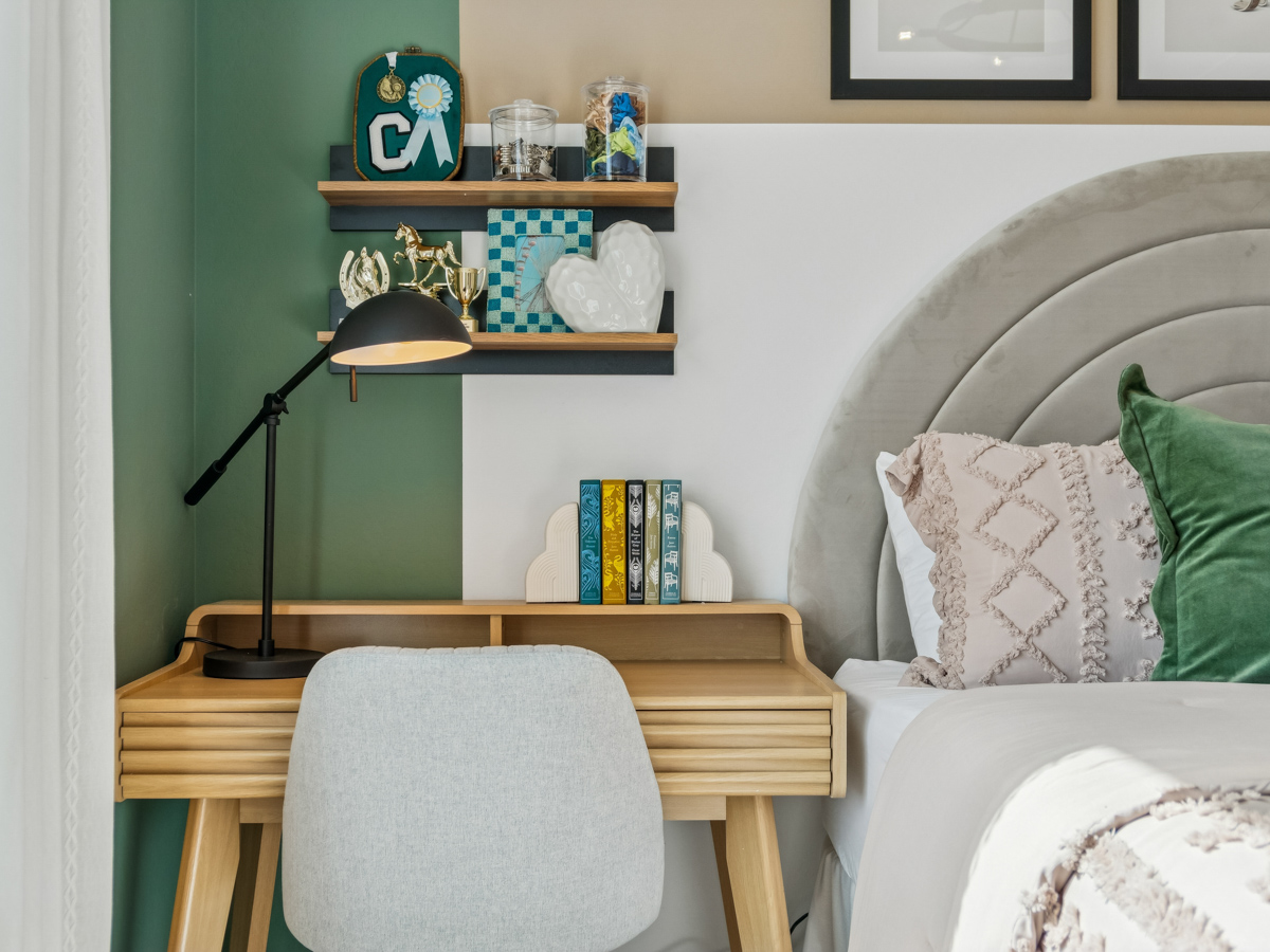 A chair and a shelf with objects on it.