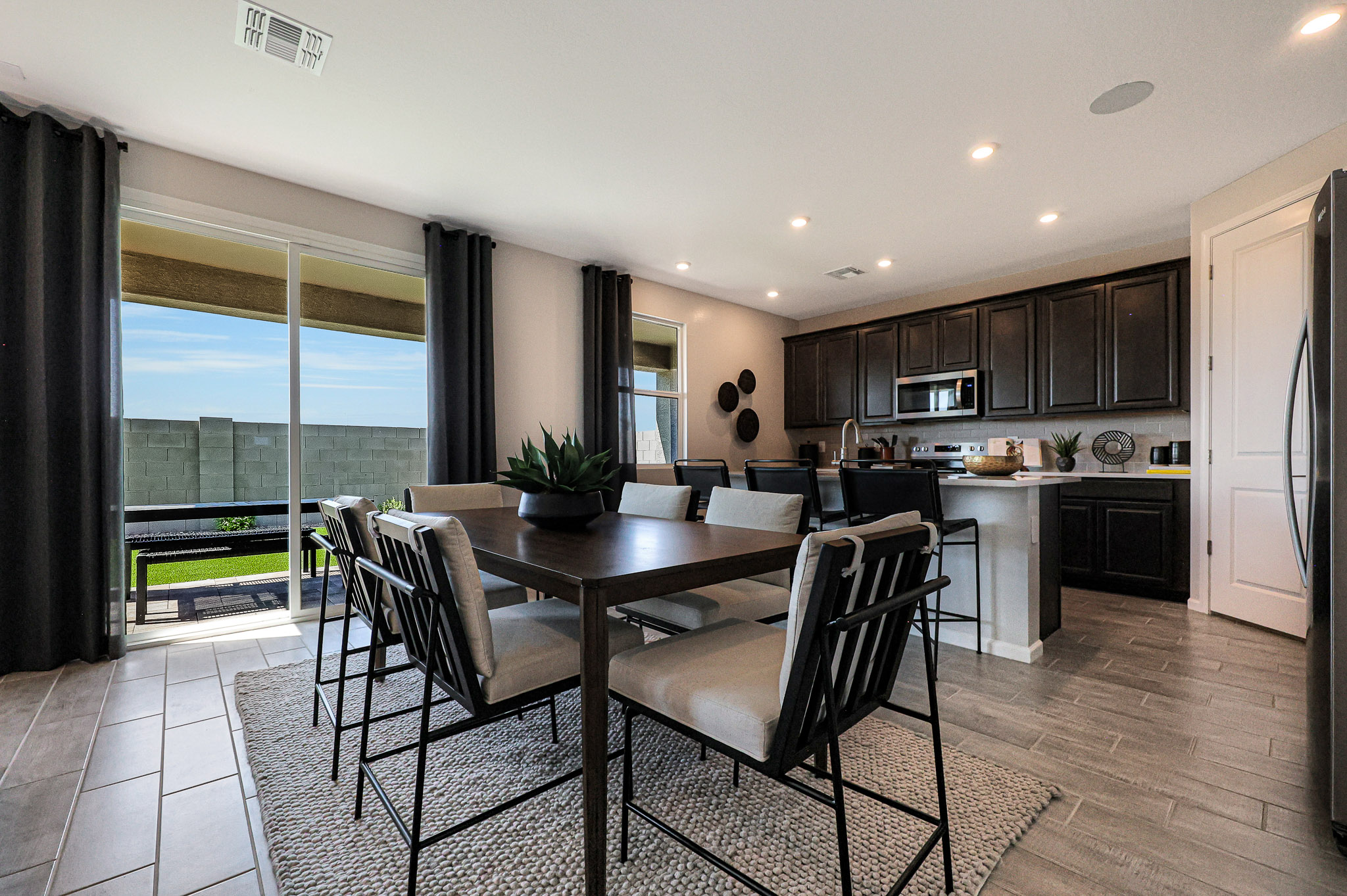 A kitchen with a dining table.