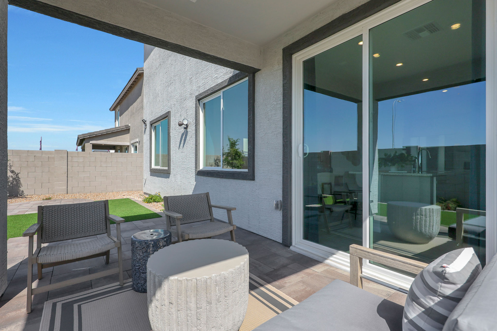 A house with a patio and a pool.