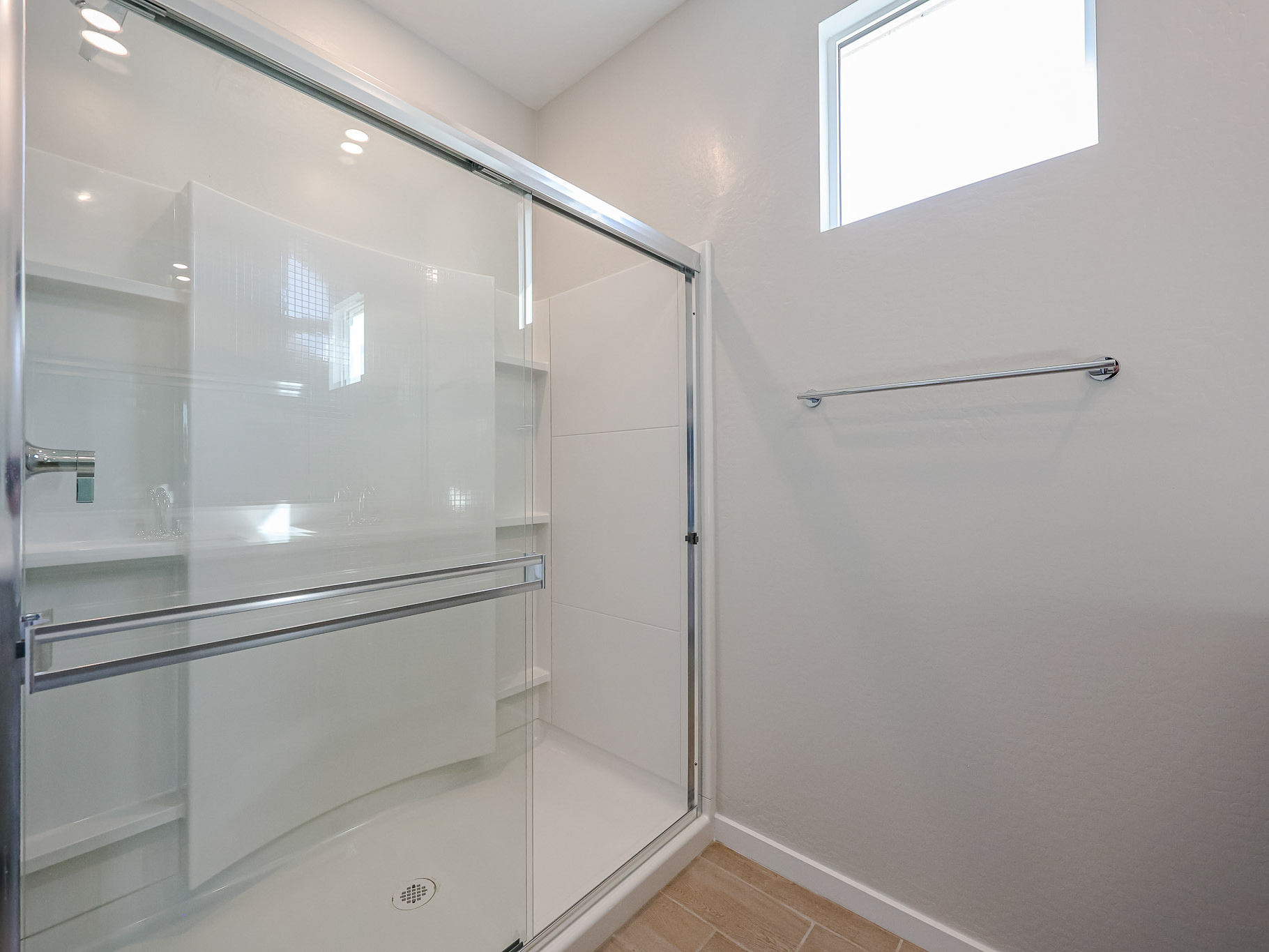 A shower with glass doors.