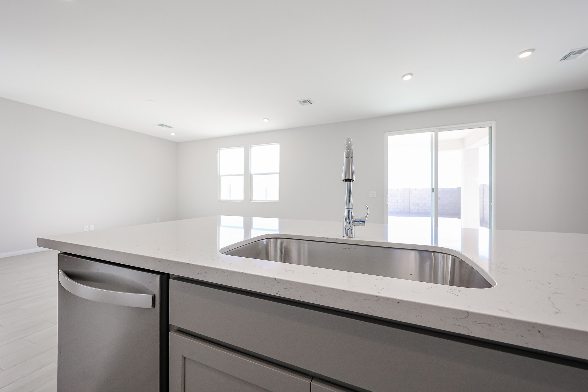 A kitchen with a sink and a window.