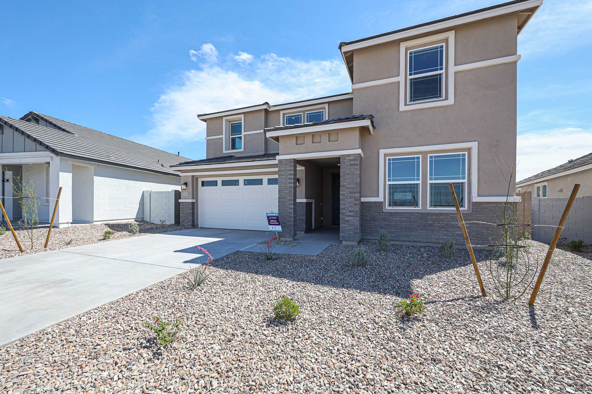 A house with a gravel yard.