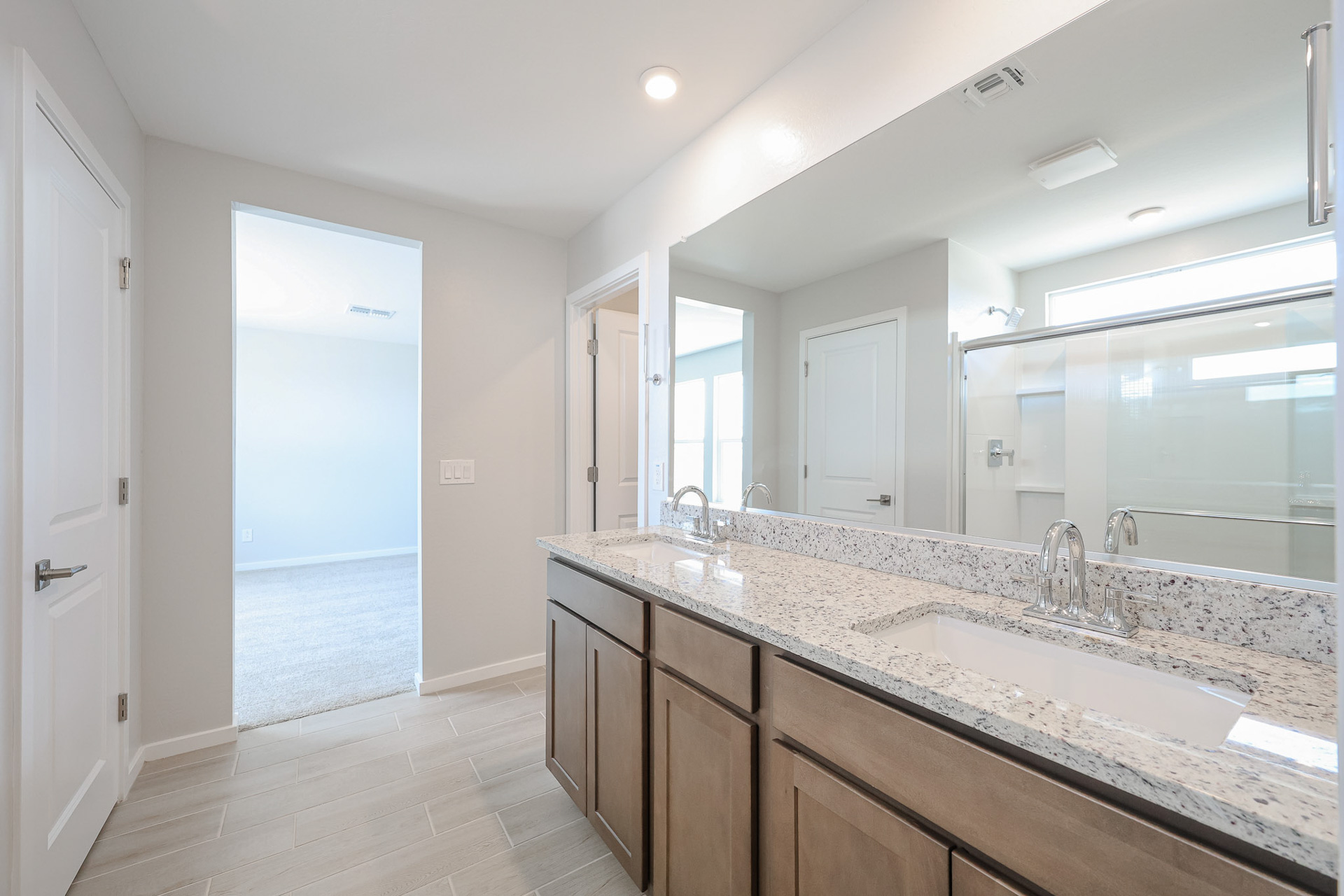 A bathroom with marble counter tops.