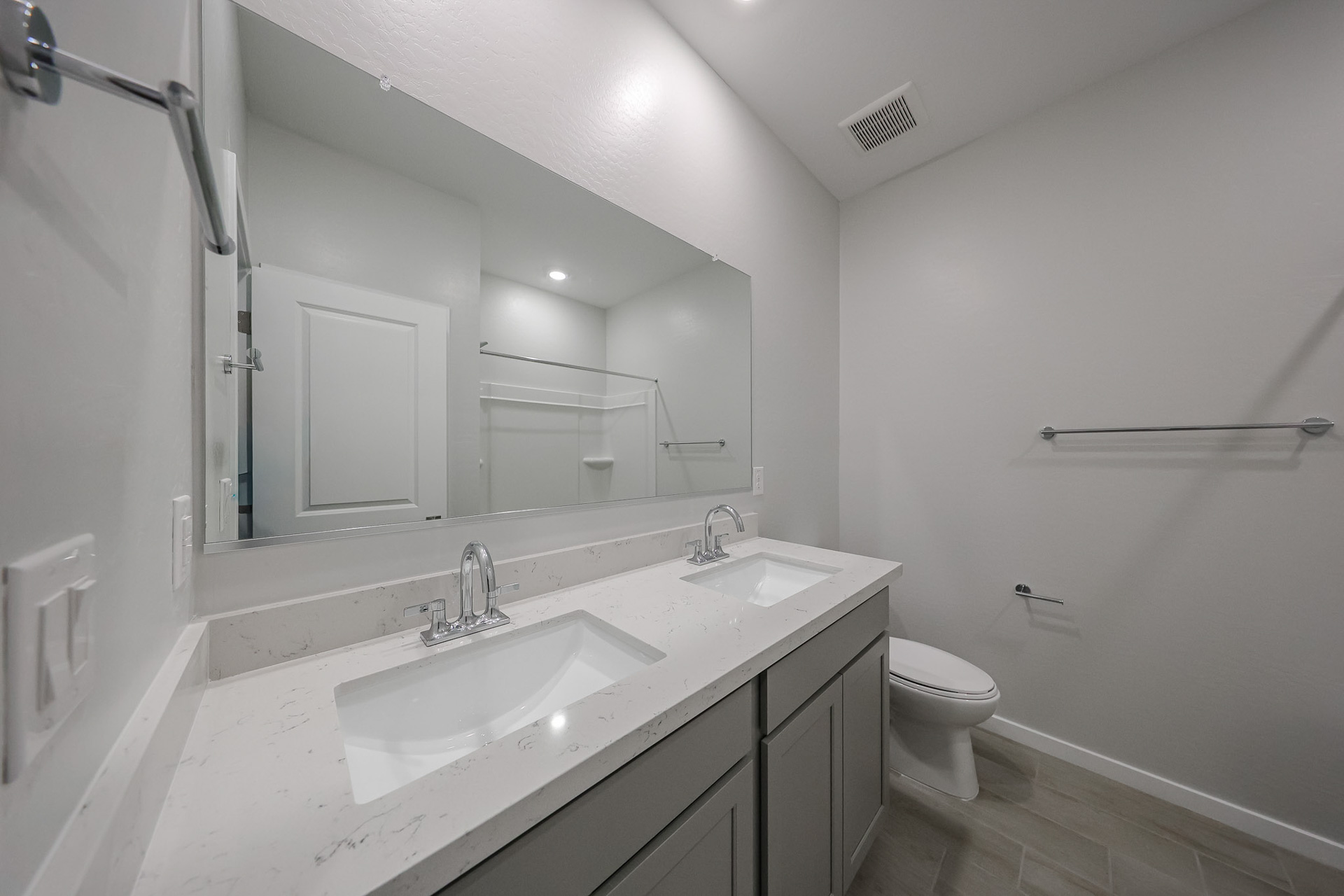 A bathroom with a sink and a toilet.