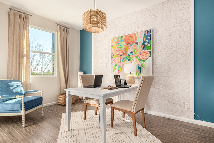 A room with a table and chairs.