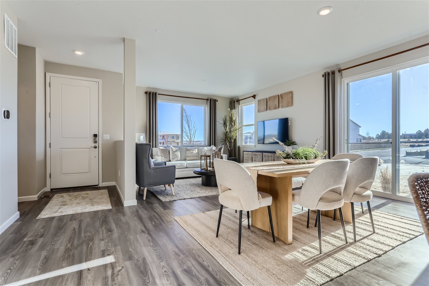 A dining room with a large window.