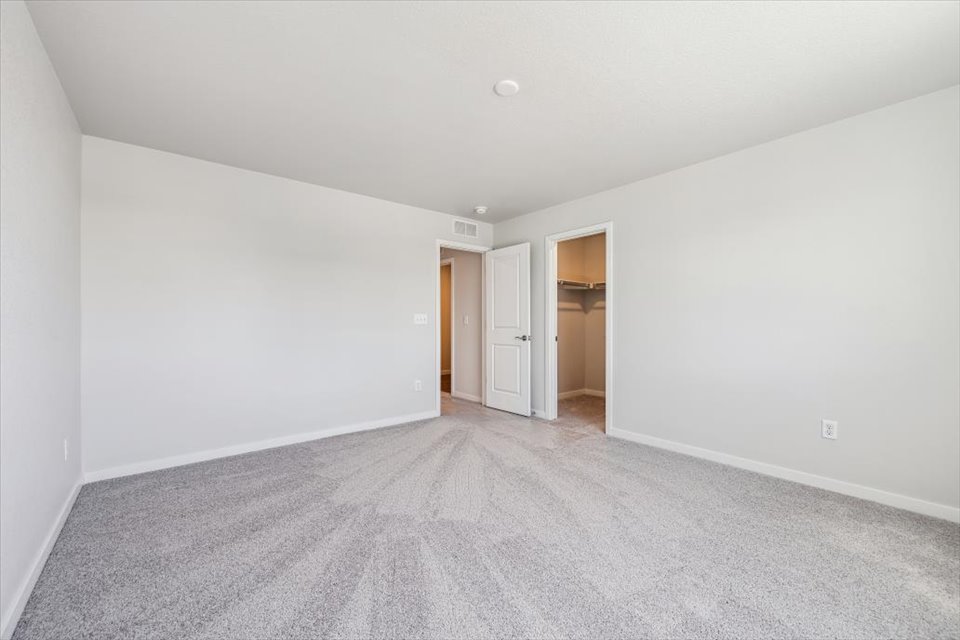 A hallway with white walls.