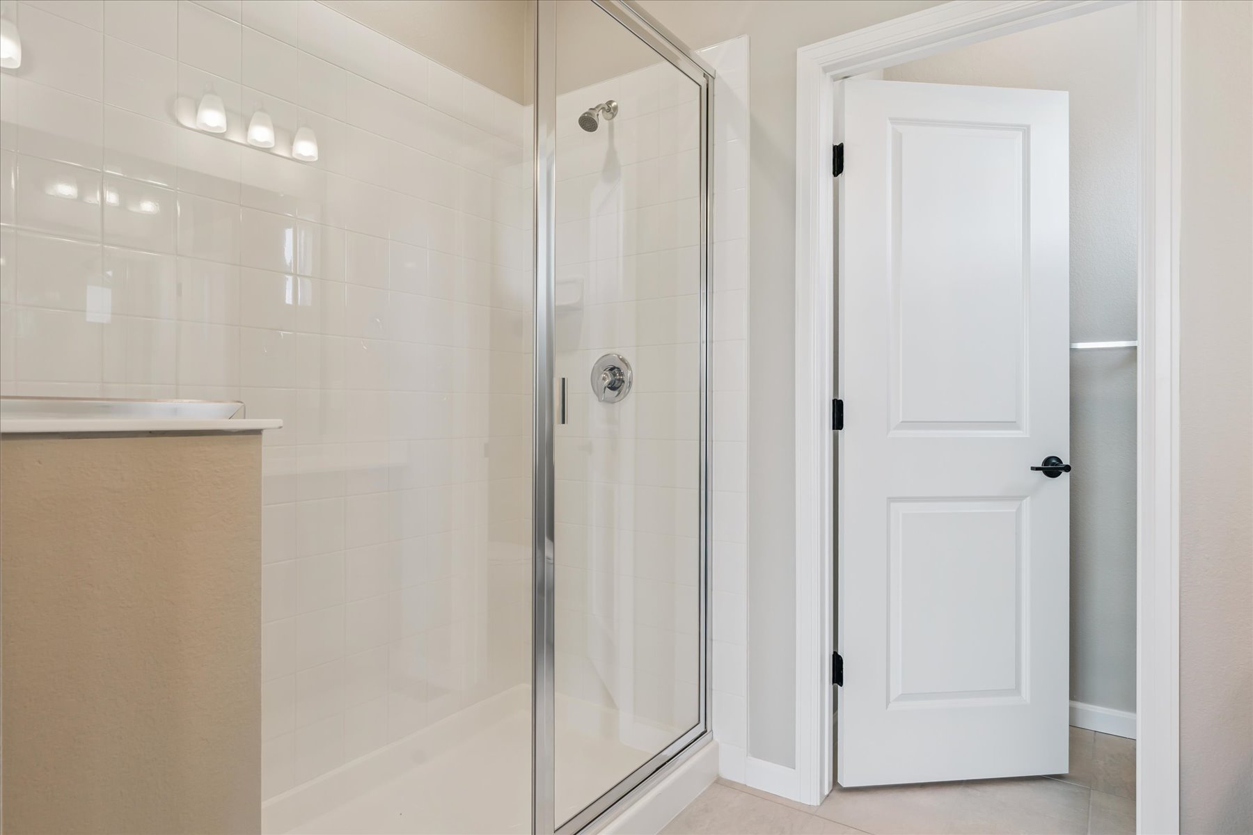 A bathroom with a glass shower.