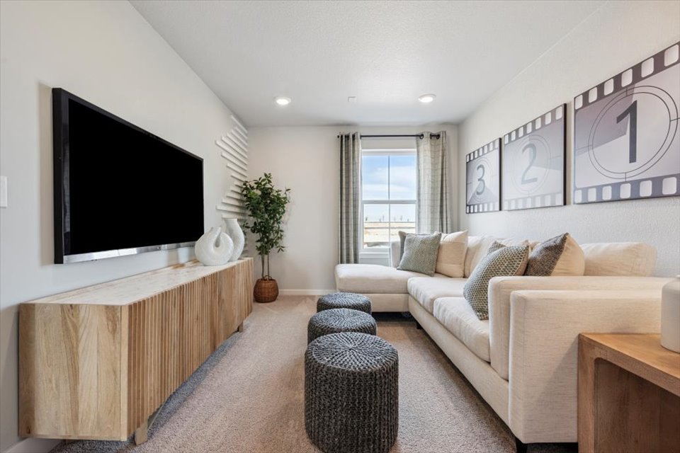 A living room with a tv and couches.