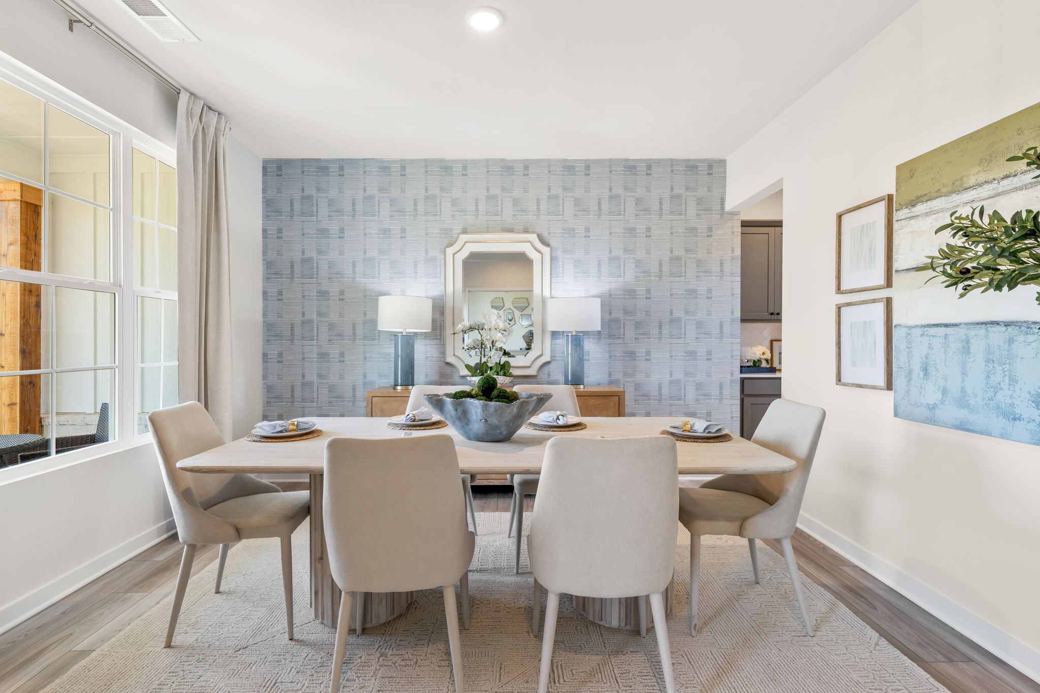 A dining room with a round table.