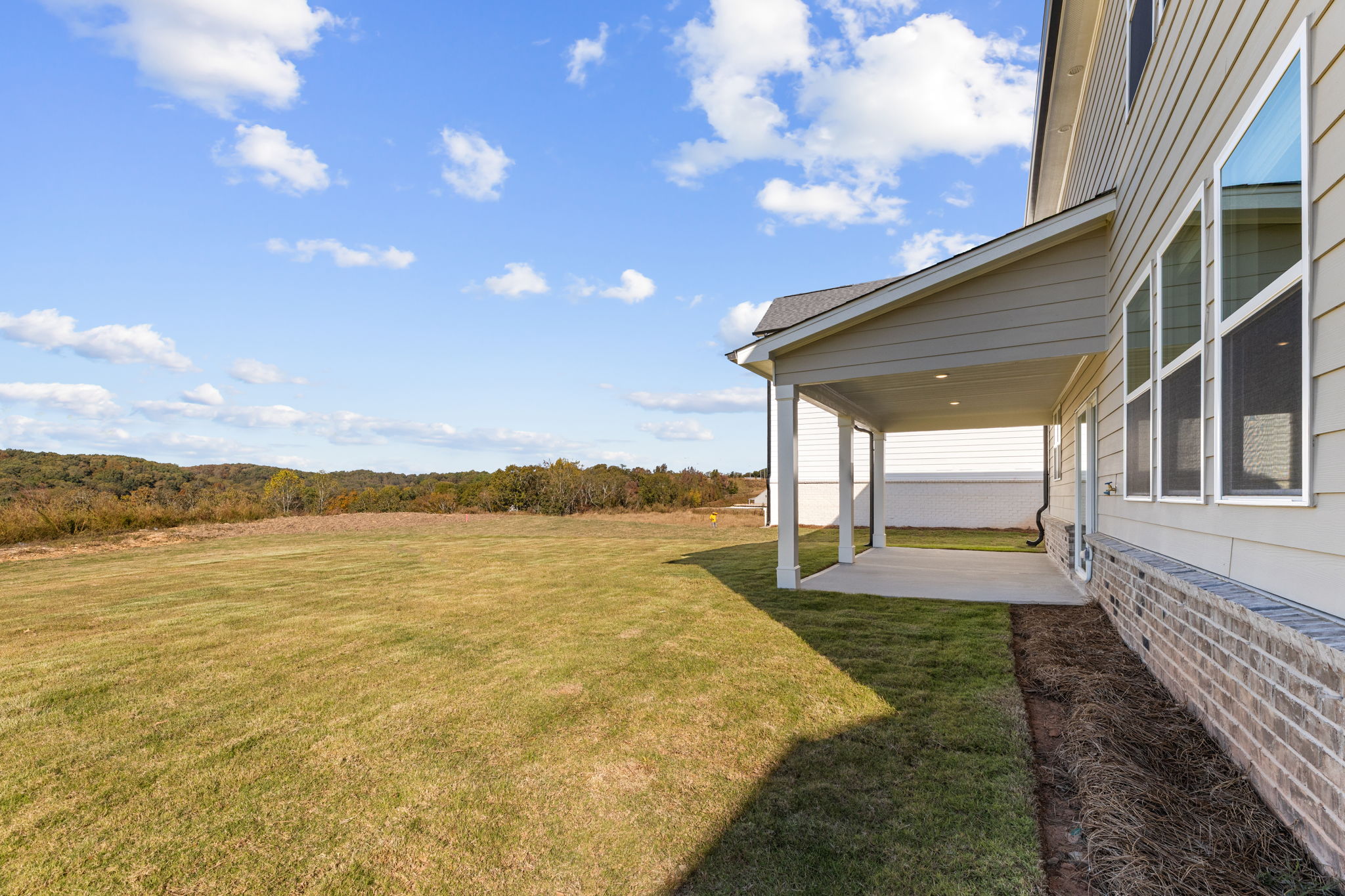 A grassy area next to a building.