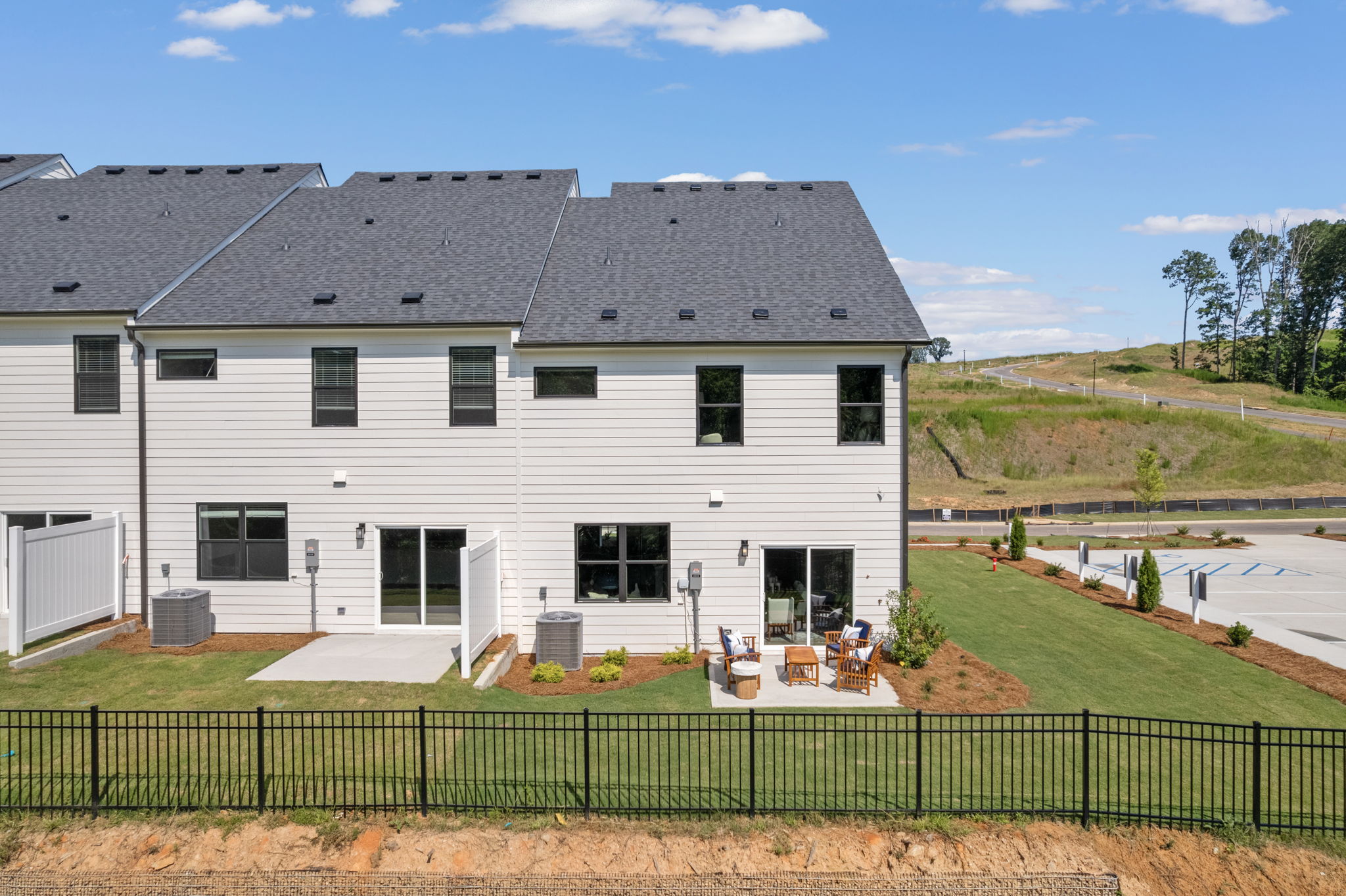 A white house with a fence.
