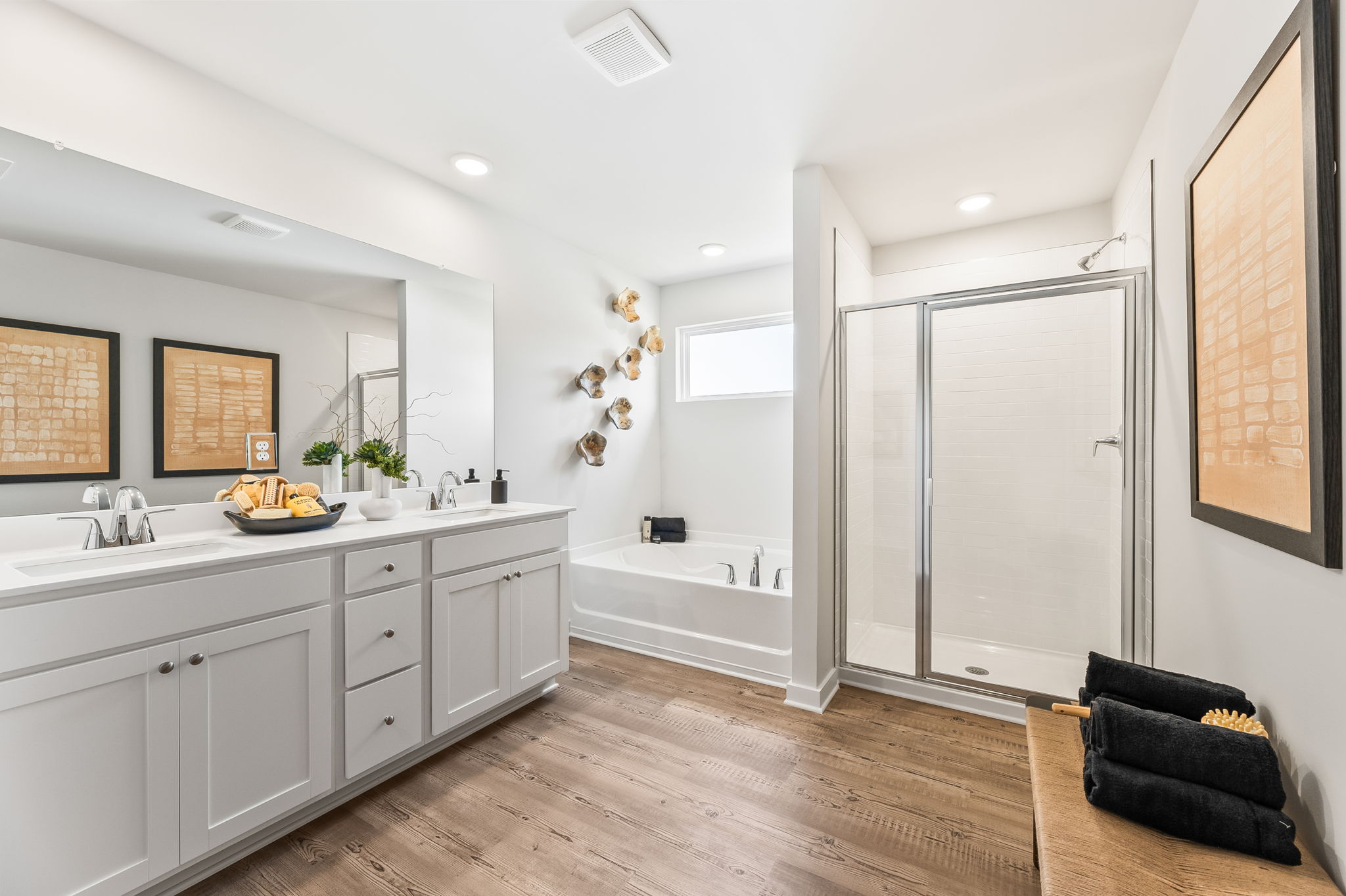 A bathroom with a tub and sink.