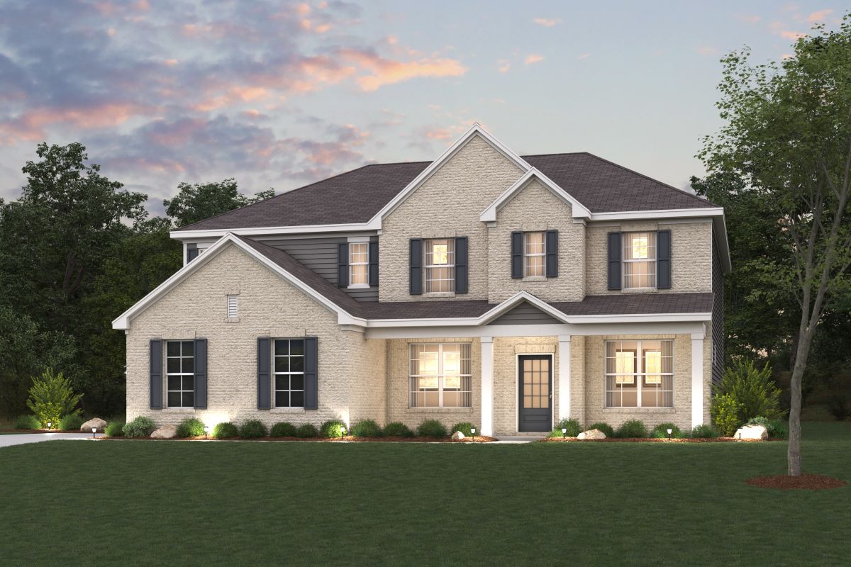 A large house with a lawn in front of it.