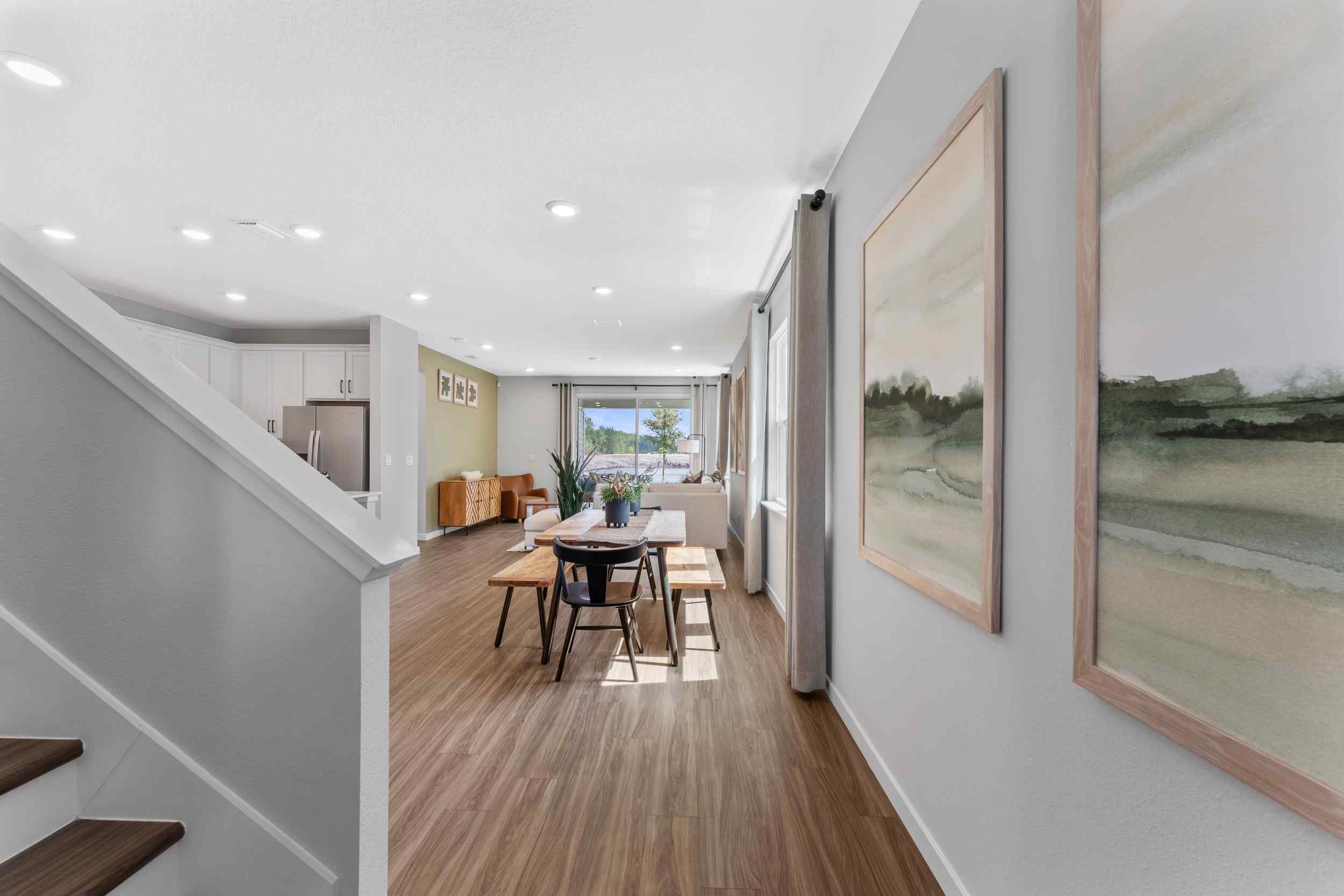 A room with a table and chairs.