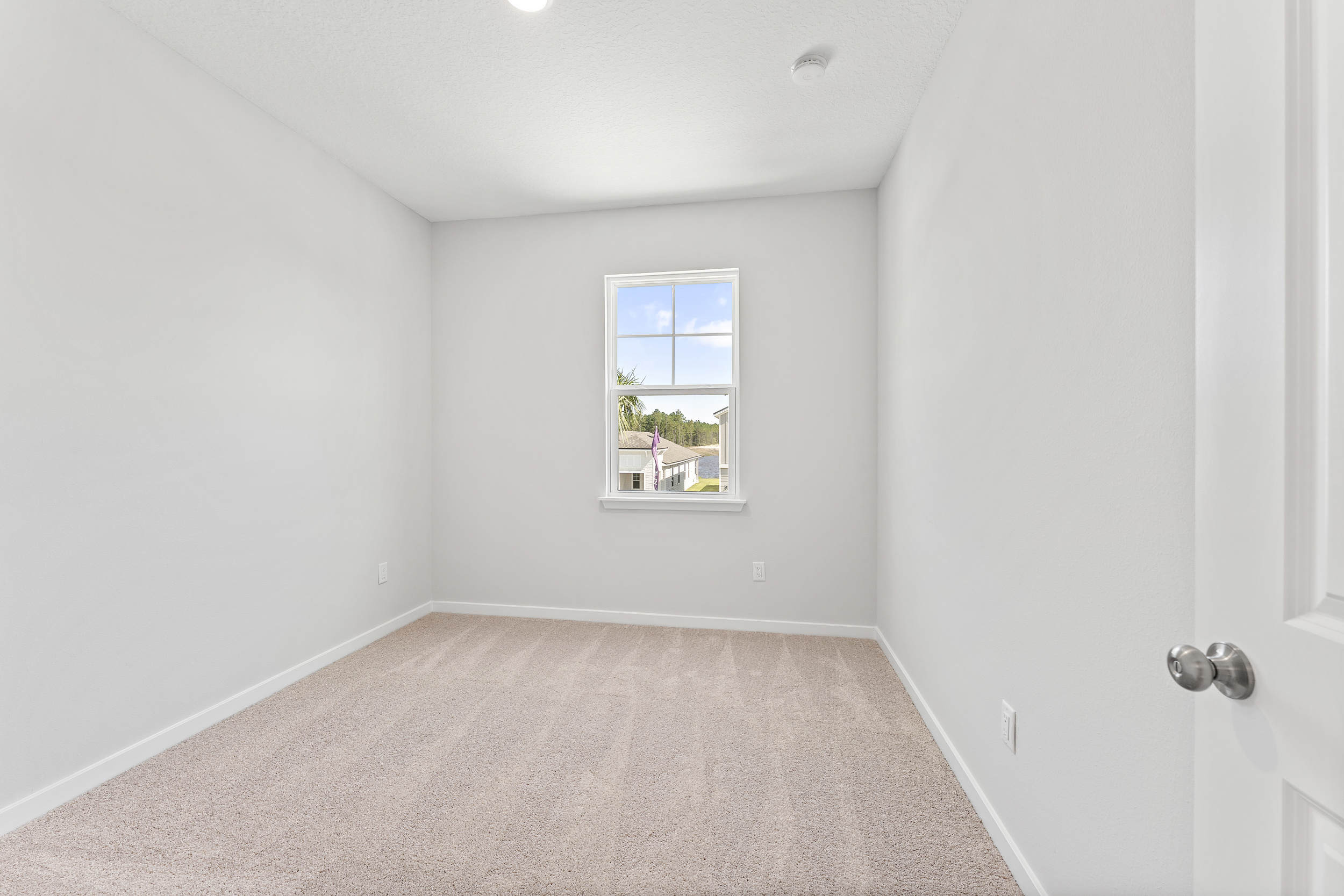 Lot 20 Ponderosa II Guest Bedroom with Front Window at Camden Woods in Kingsland, GA