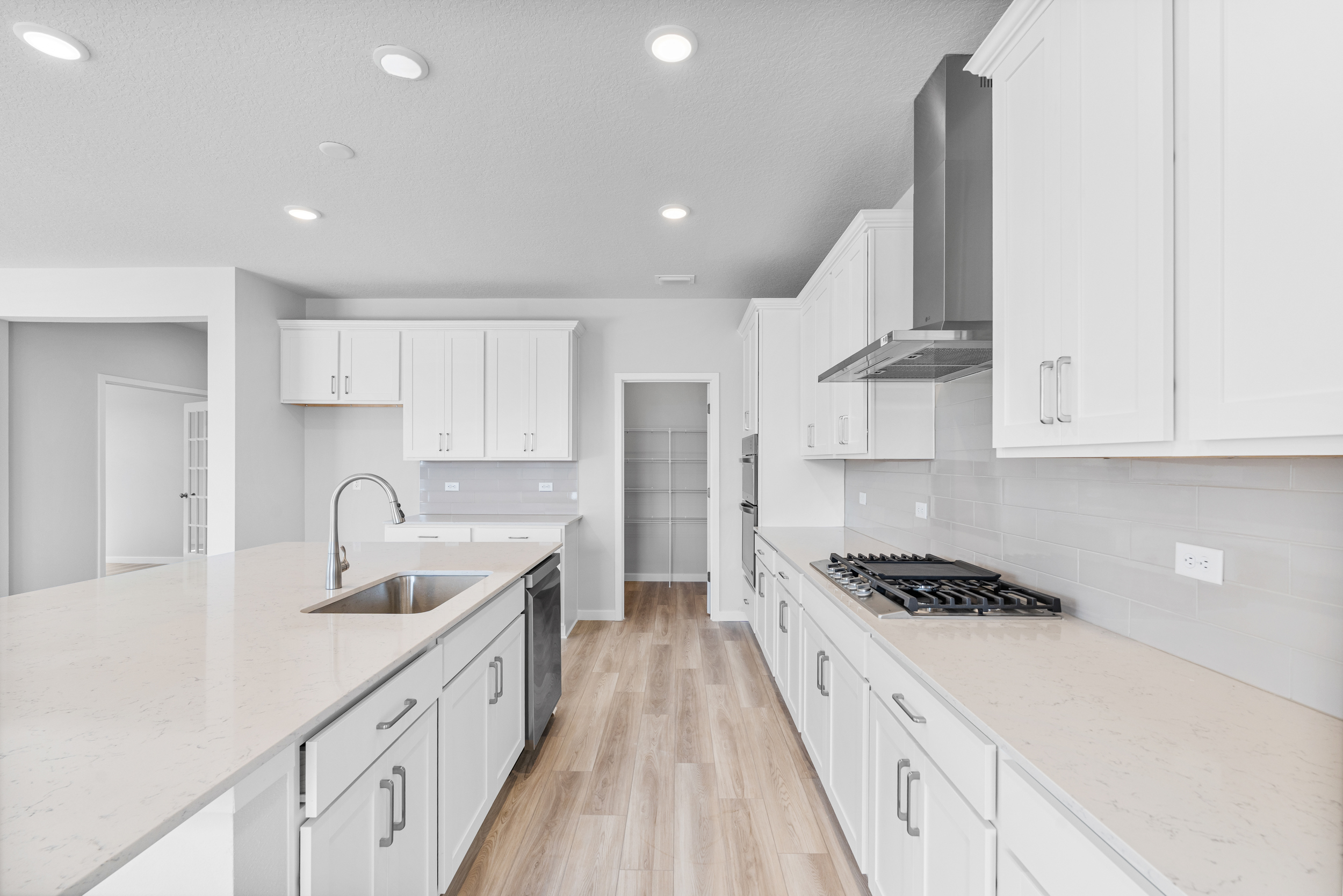 Lot 46 Chef's Kitchen with Walk-In Pantry at Reserve East