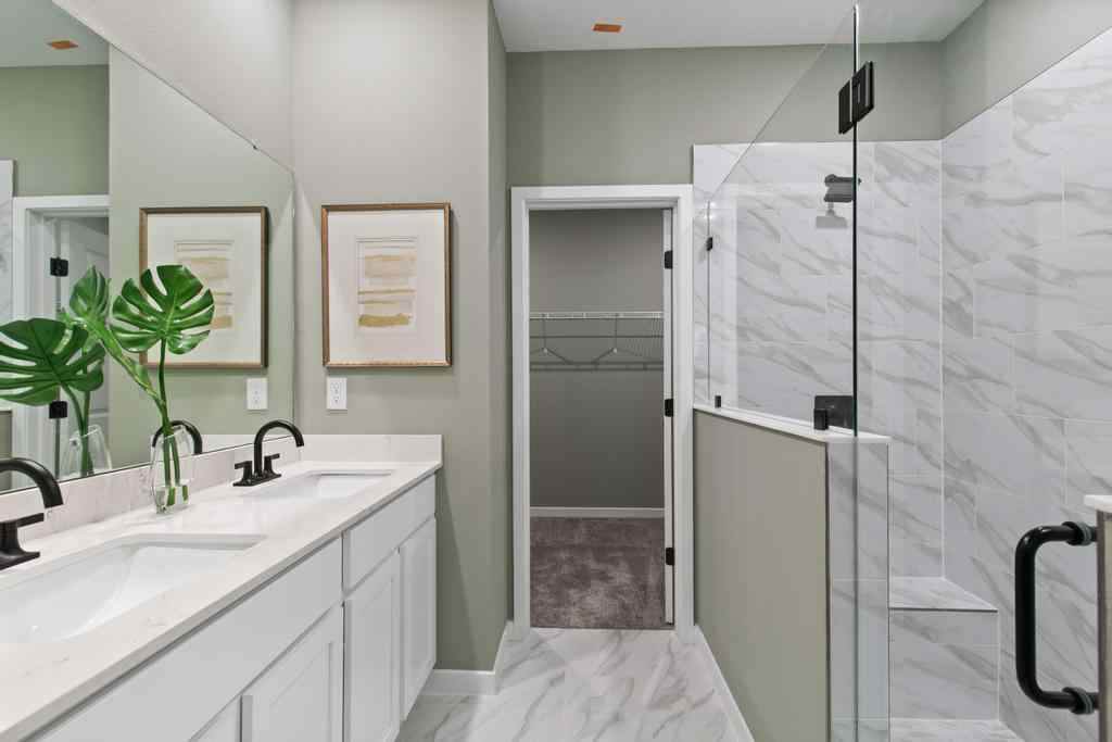 A bathroom with a glass shower.