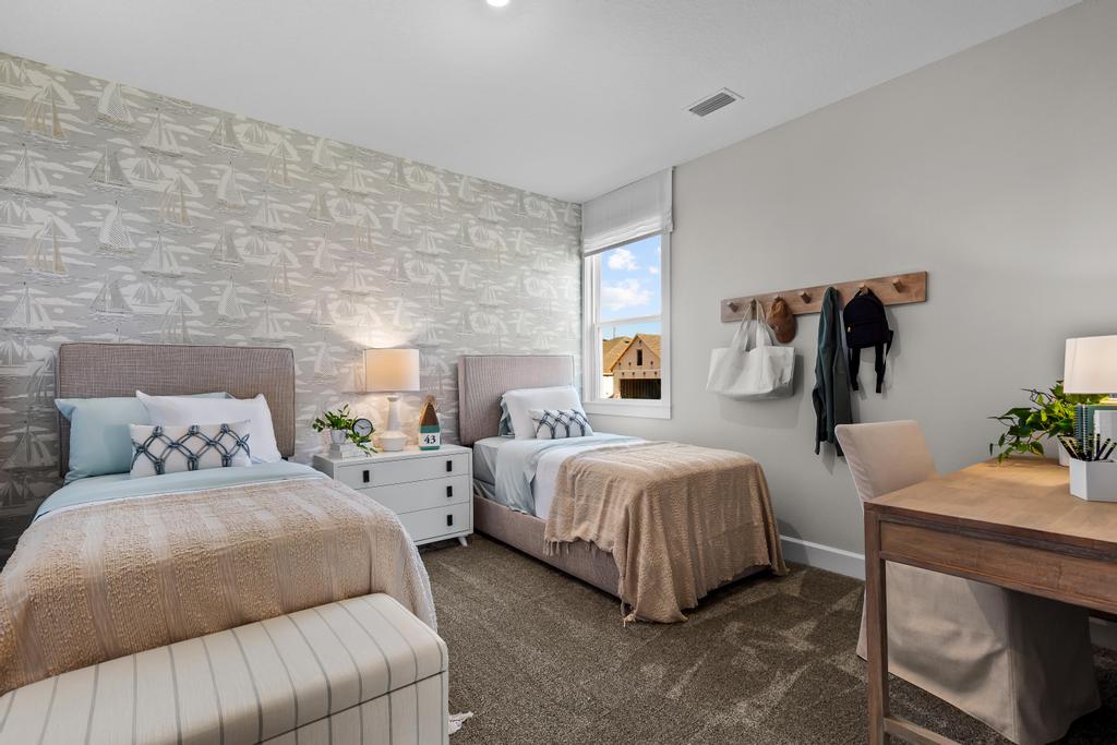 A bedroom with two beds.