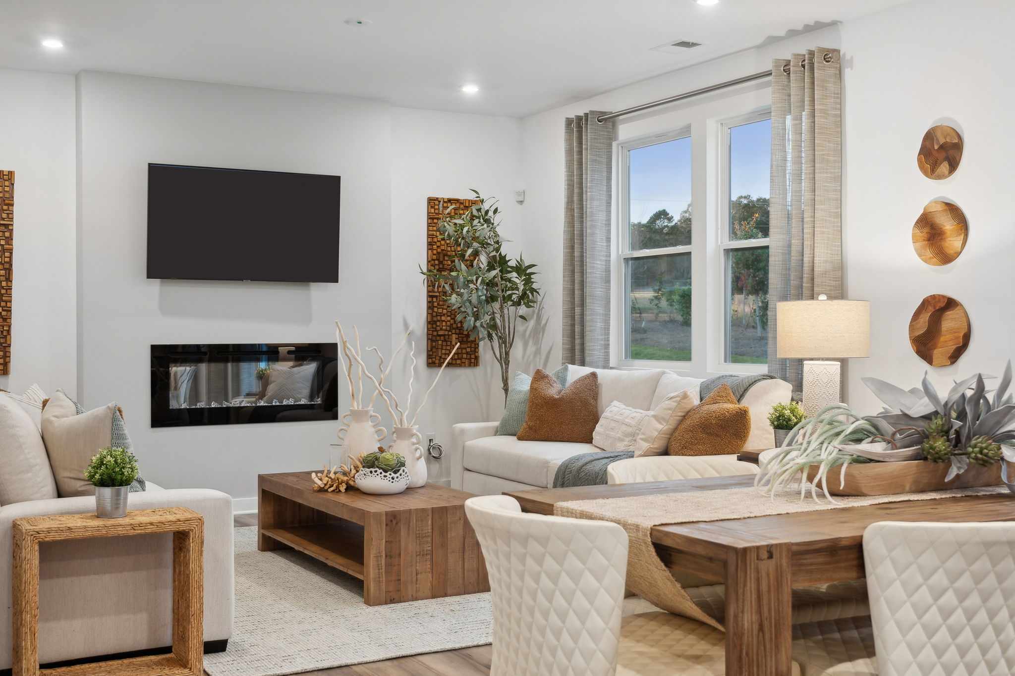 A living room with a tv and couches.