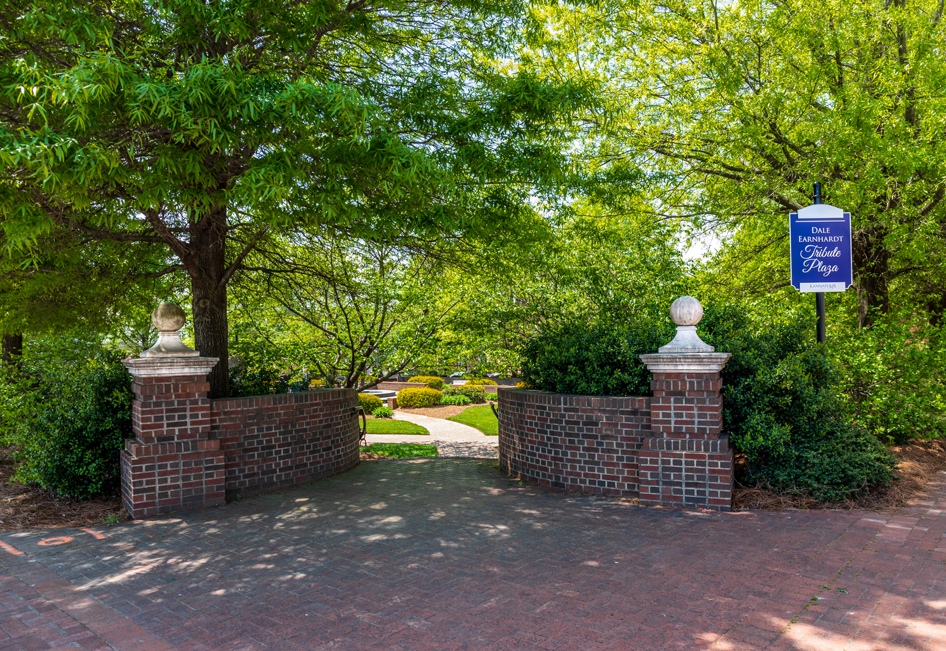 A brick wall with a sign on it.