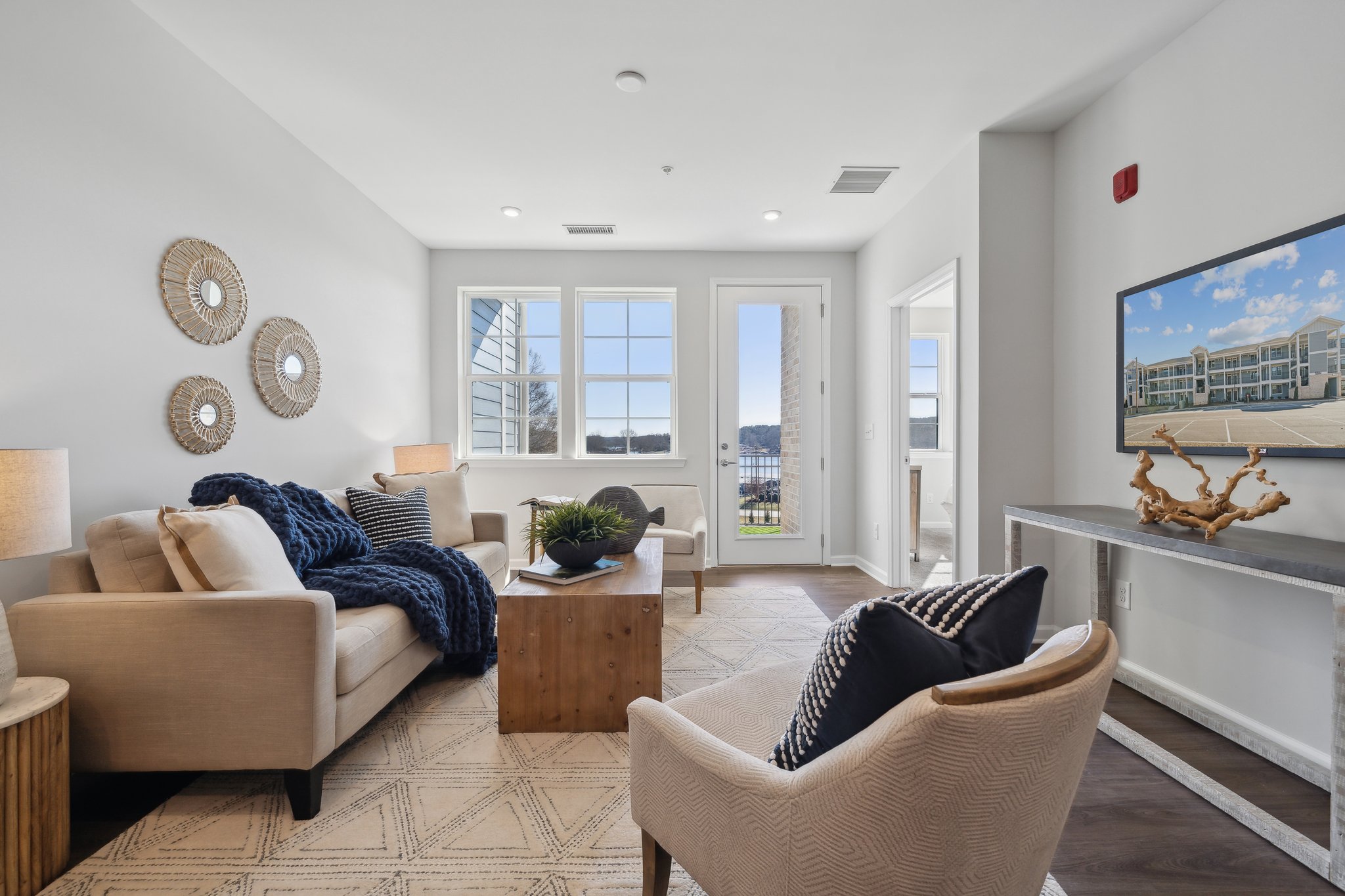 A living room with a couch and a table.