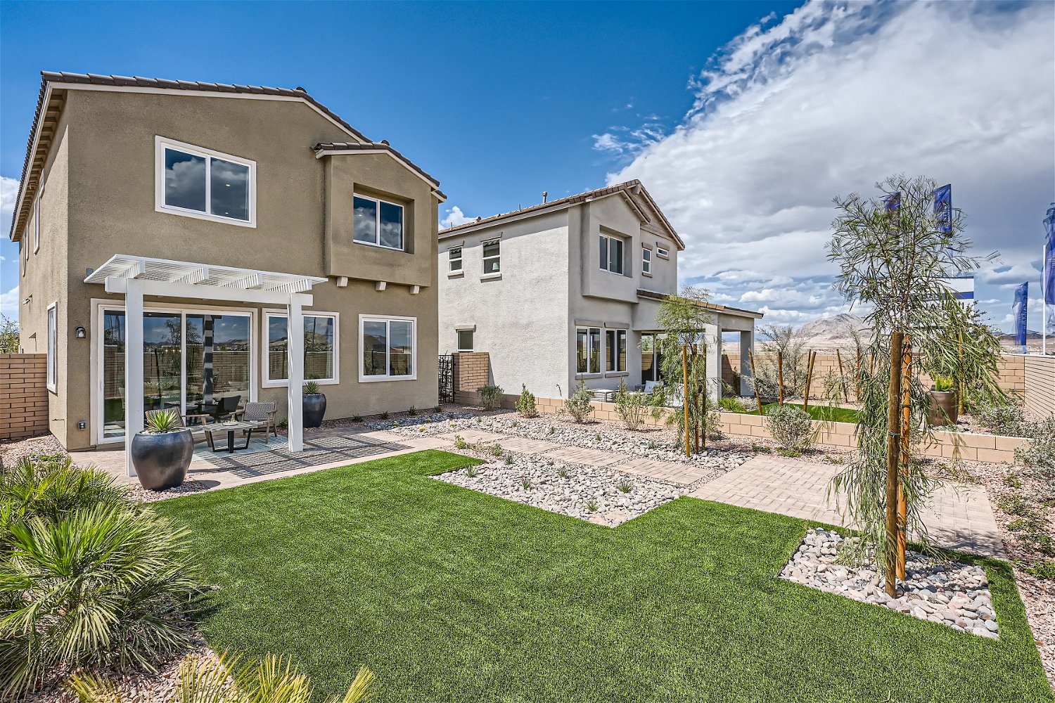 A building with a lawn and trees.