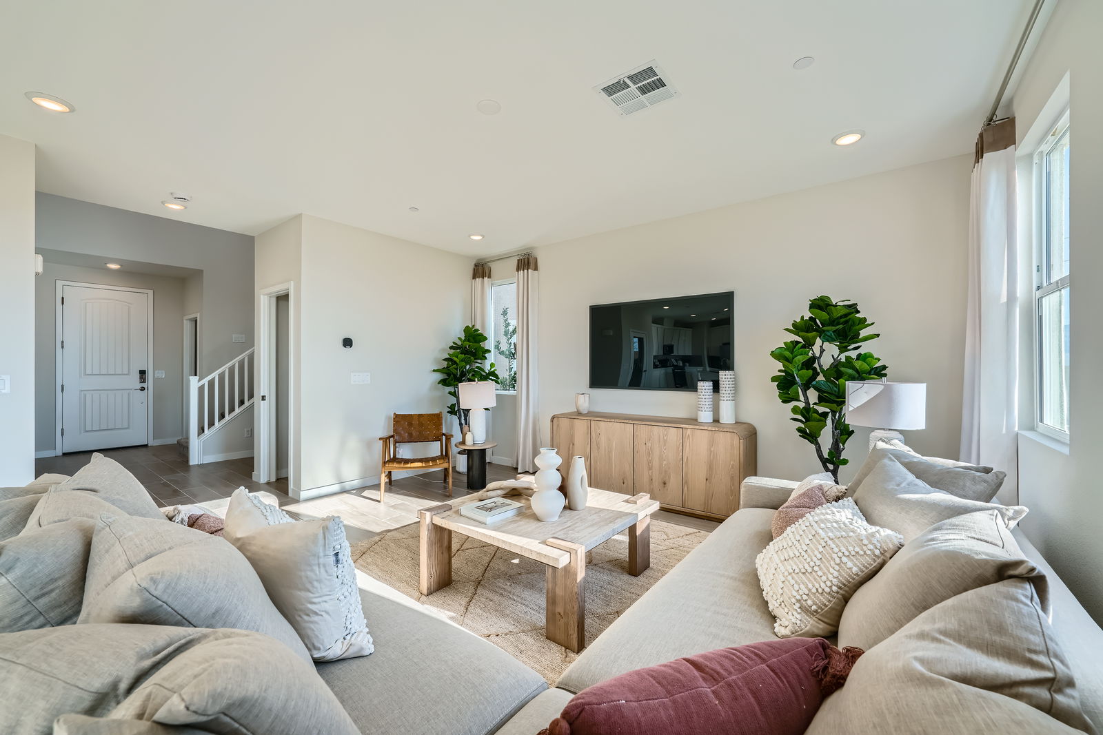 A living room with a couch and a table.