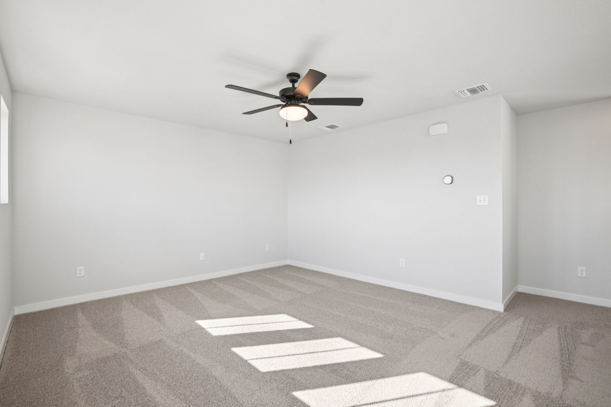 A ceiling fan in a room.