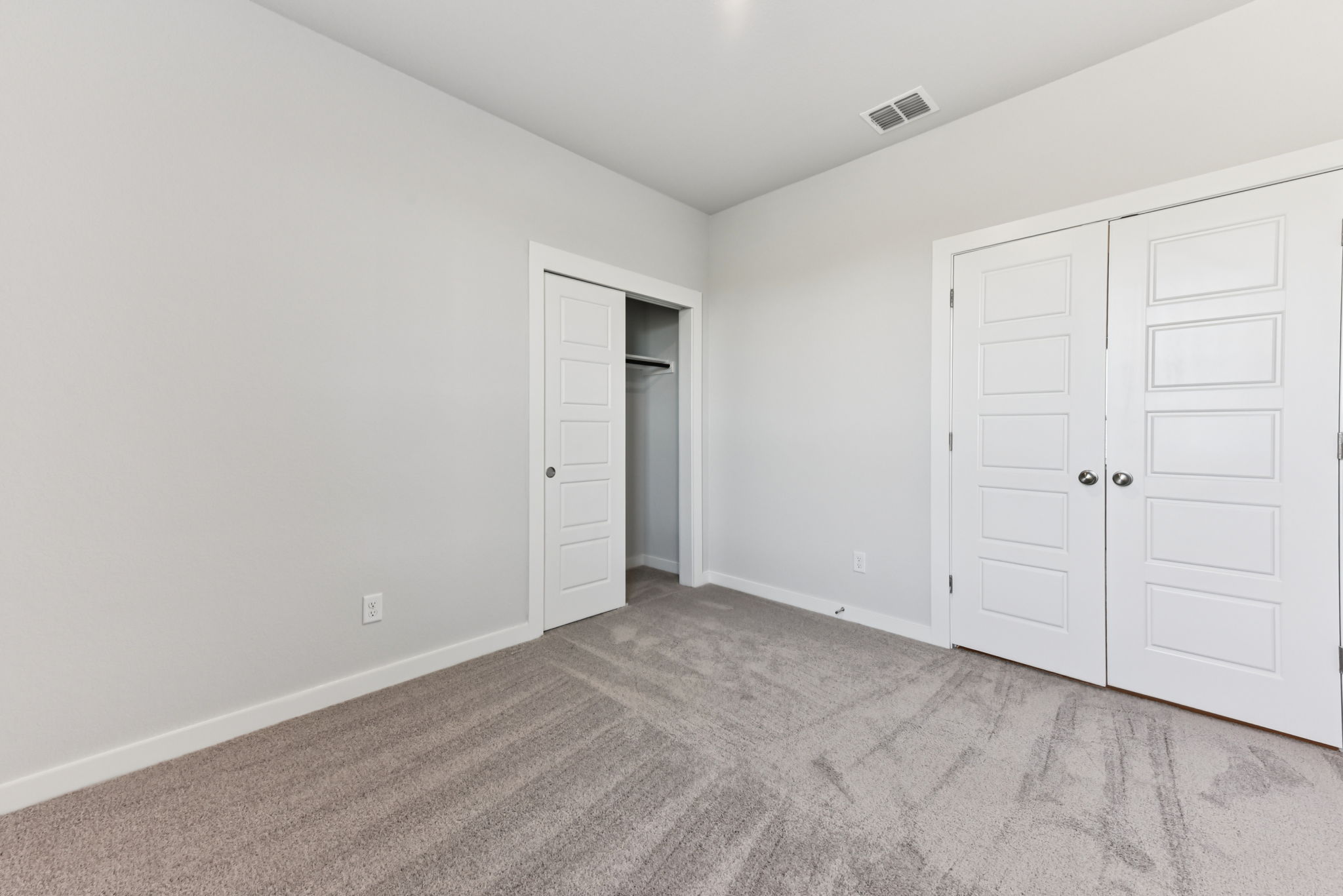 A room with white doors.