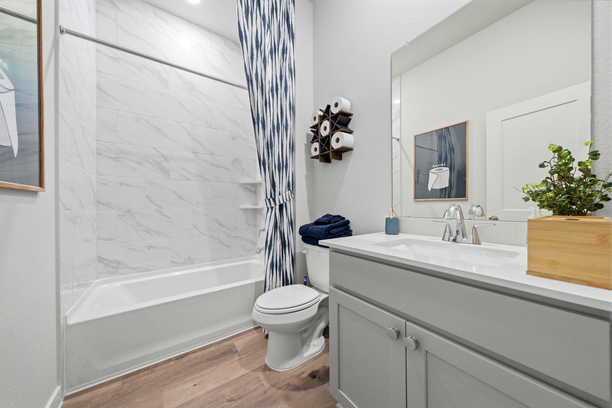 A bathroom with a tub toilet and sink.