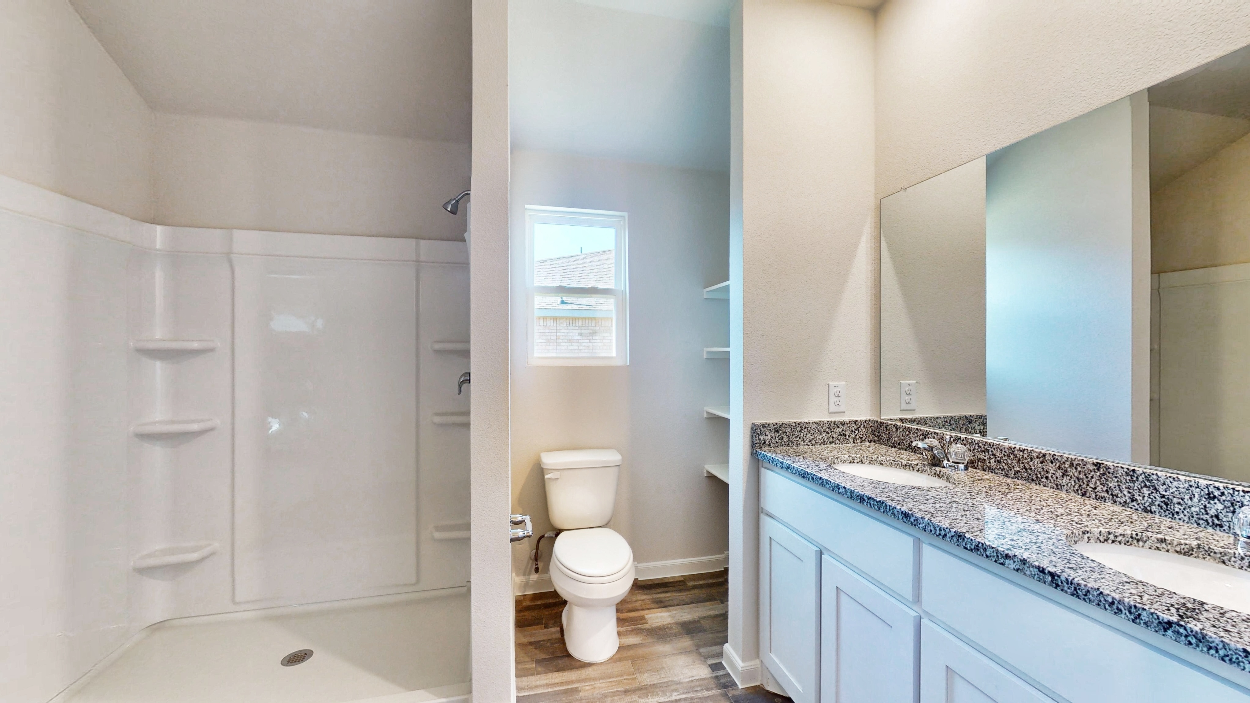 A bathroom with a marble countertop.
