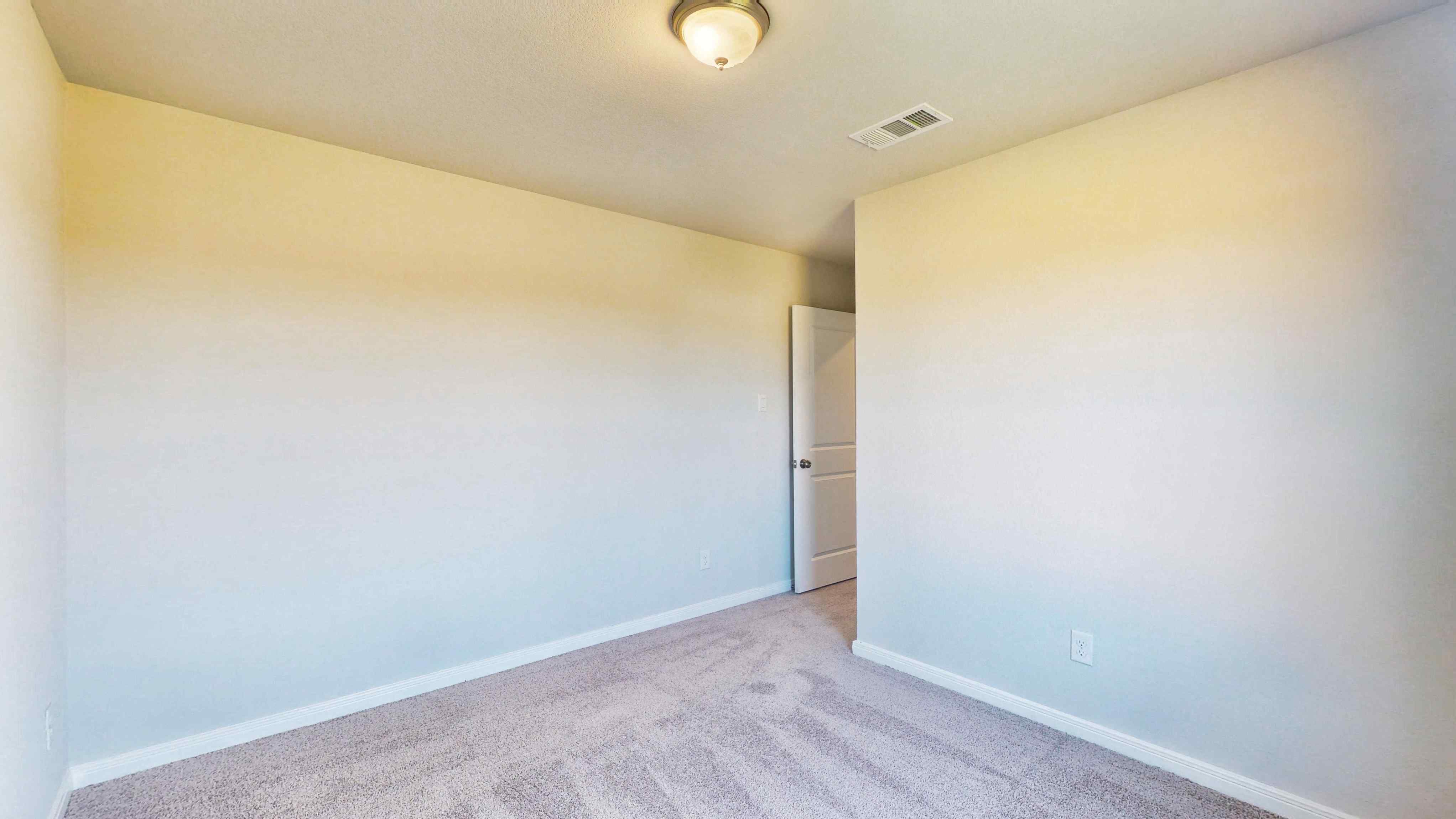 A hallway with a light on the ceiling.