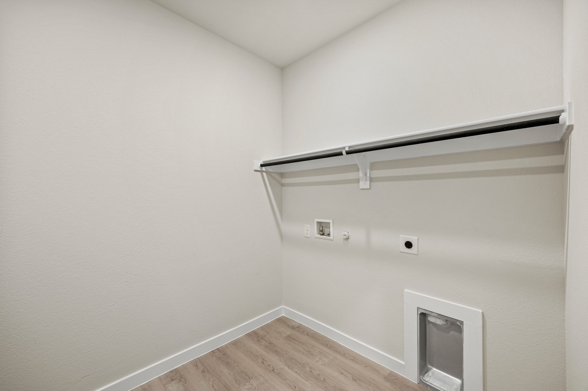 A white wall with a light on it.