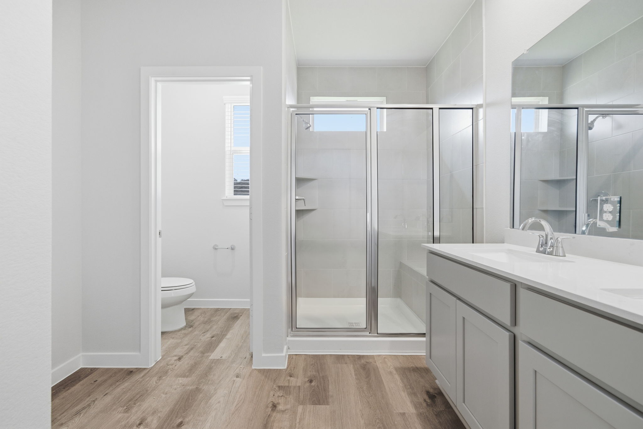 A bathroom with a glass shower.