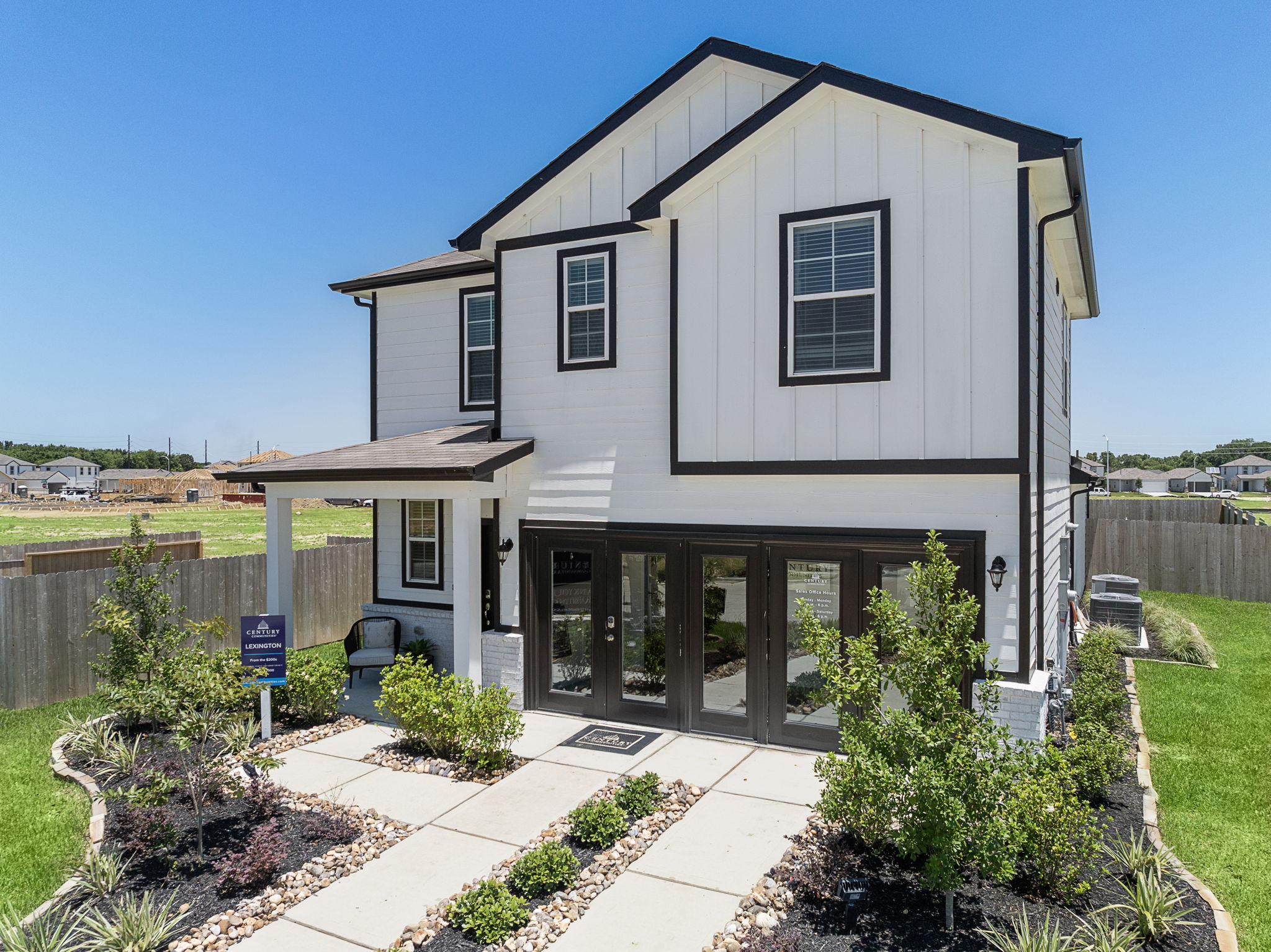 A white house with a fence.