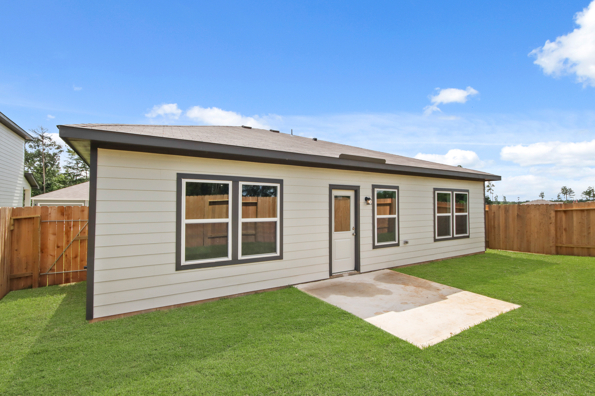 A small house with a fence.