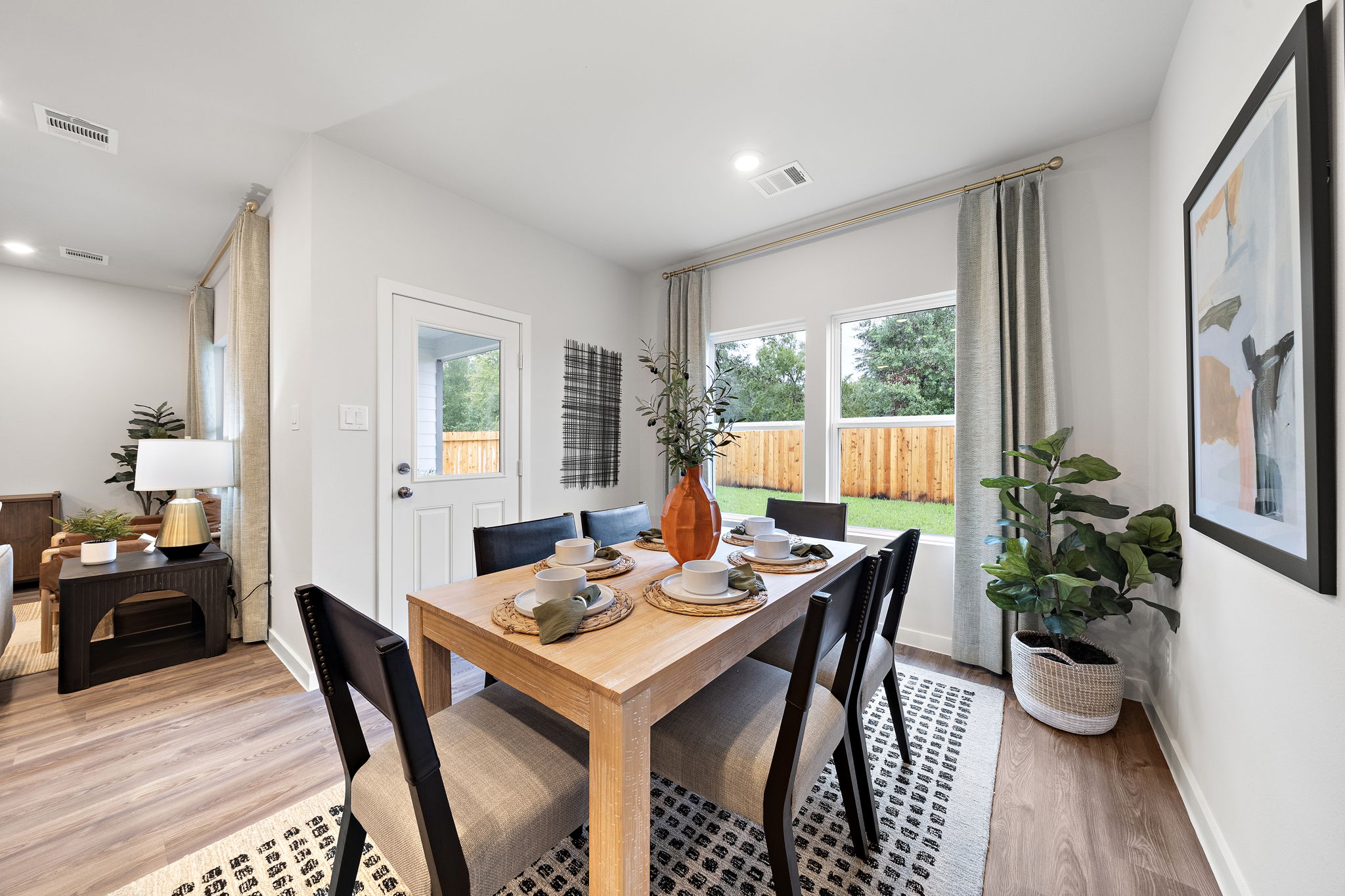 A dining room table with chairs.