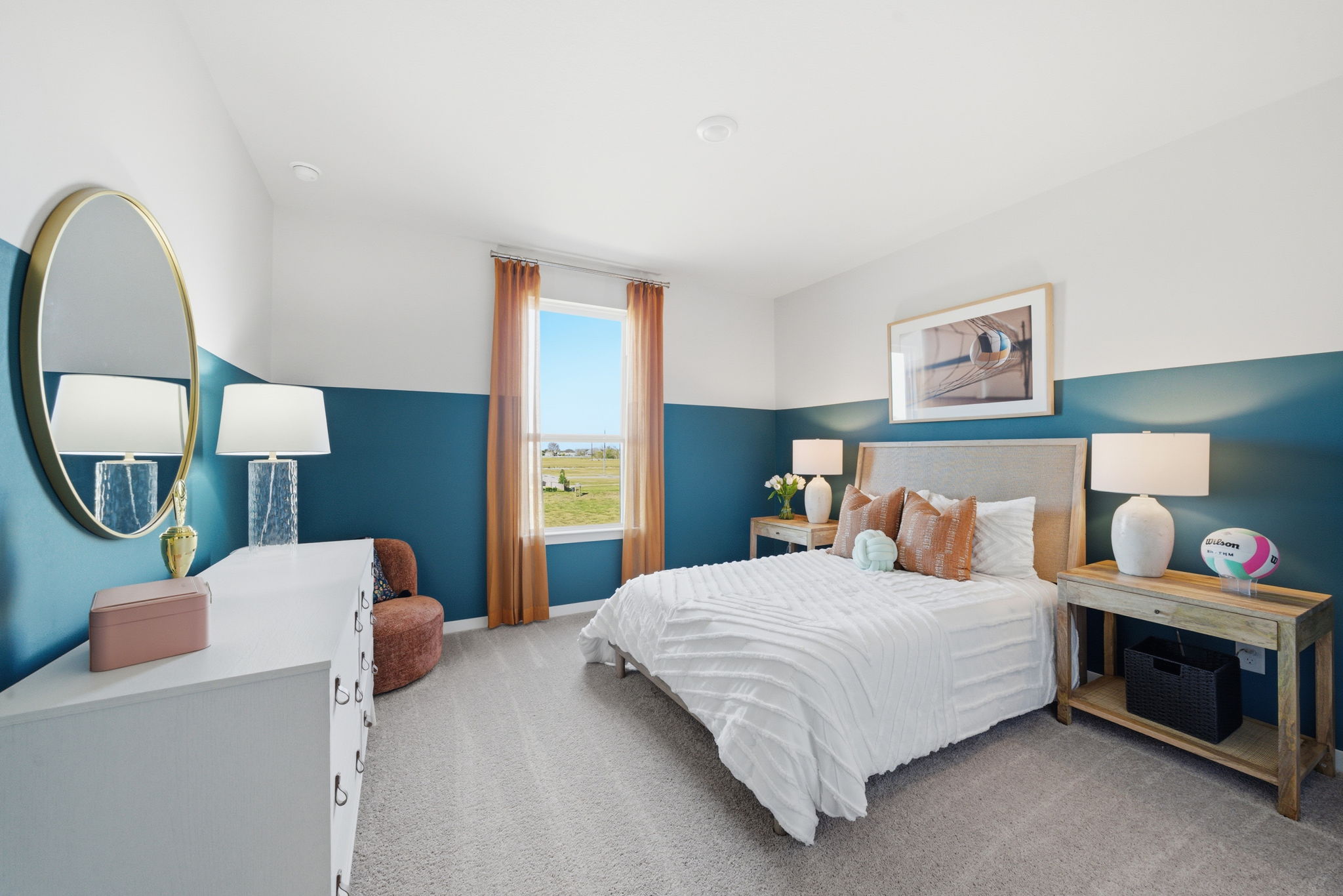 A bedroom with a bed and a mirror.